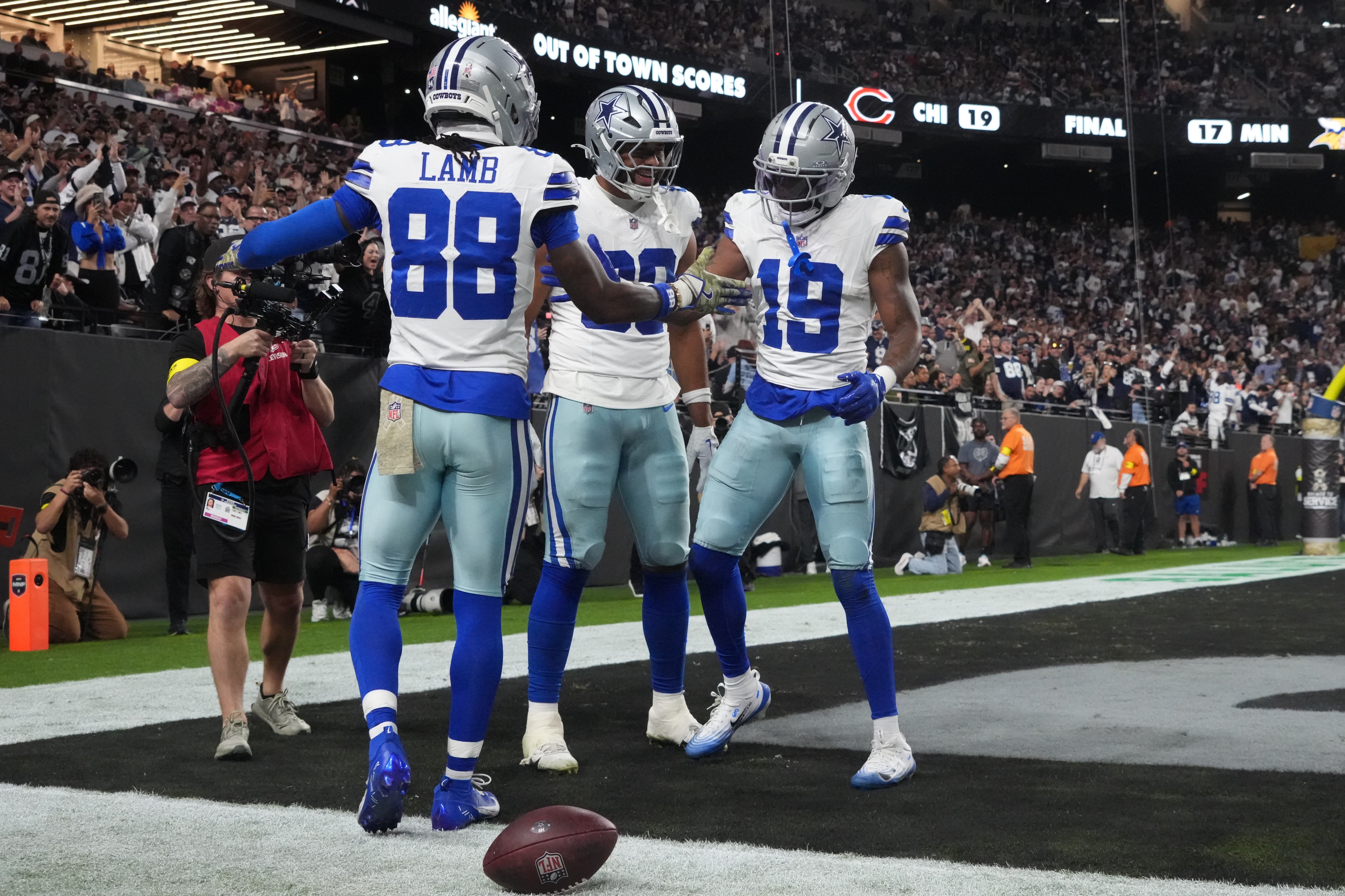 Nov 17, 2025; Paradise, Nevada, USA; Dallas Cowboys wide receiver Ryan Flournoy (19) celebrates a touchdown catch with wide receiver CeeDee Lamb (88) during the second half against the Las Vegas Raiders at Allegiant Stadium.