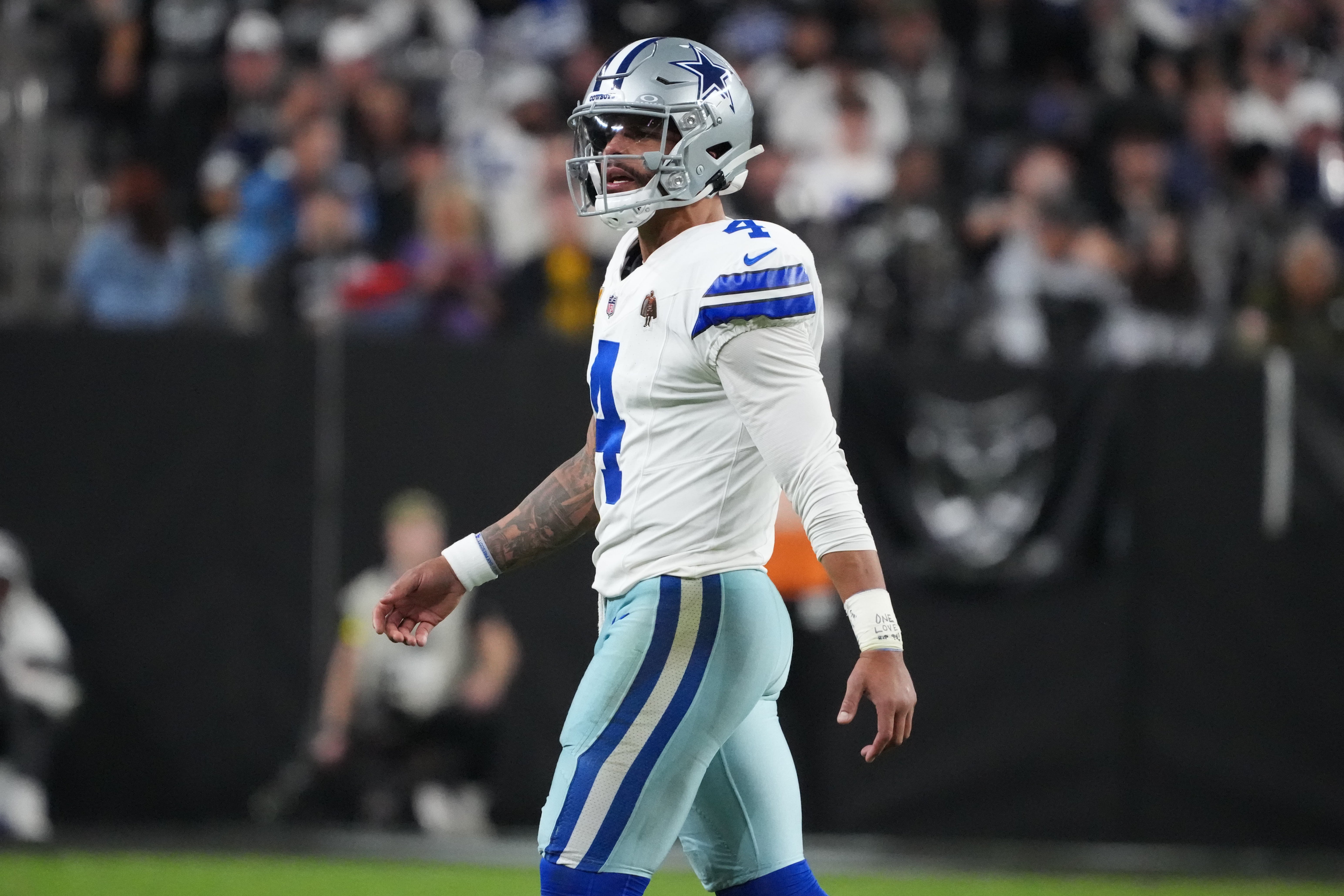 Nov 17, 2025; Paradise, Nevada, USA; Dallas Cowboys quarterback Dak Prescott (4) walks onto the field against the Las Vegas Raiders during the second half at Allegiant Stadium.
