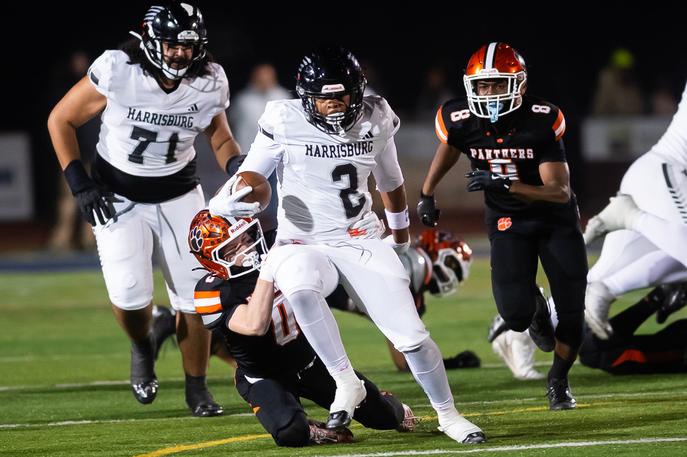 Central York's Josh Bahr (0) brings down Harrisburg running back Messiah Mickens (2) during the PIAA District 3 Class 6A Championship at Cedar Cliff High School on Friday, Nov. 21, 2025, in New Cumberland.