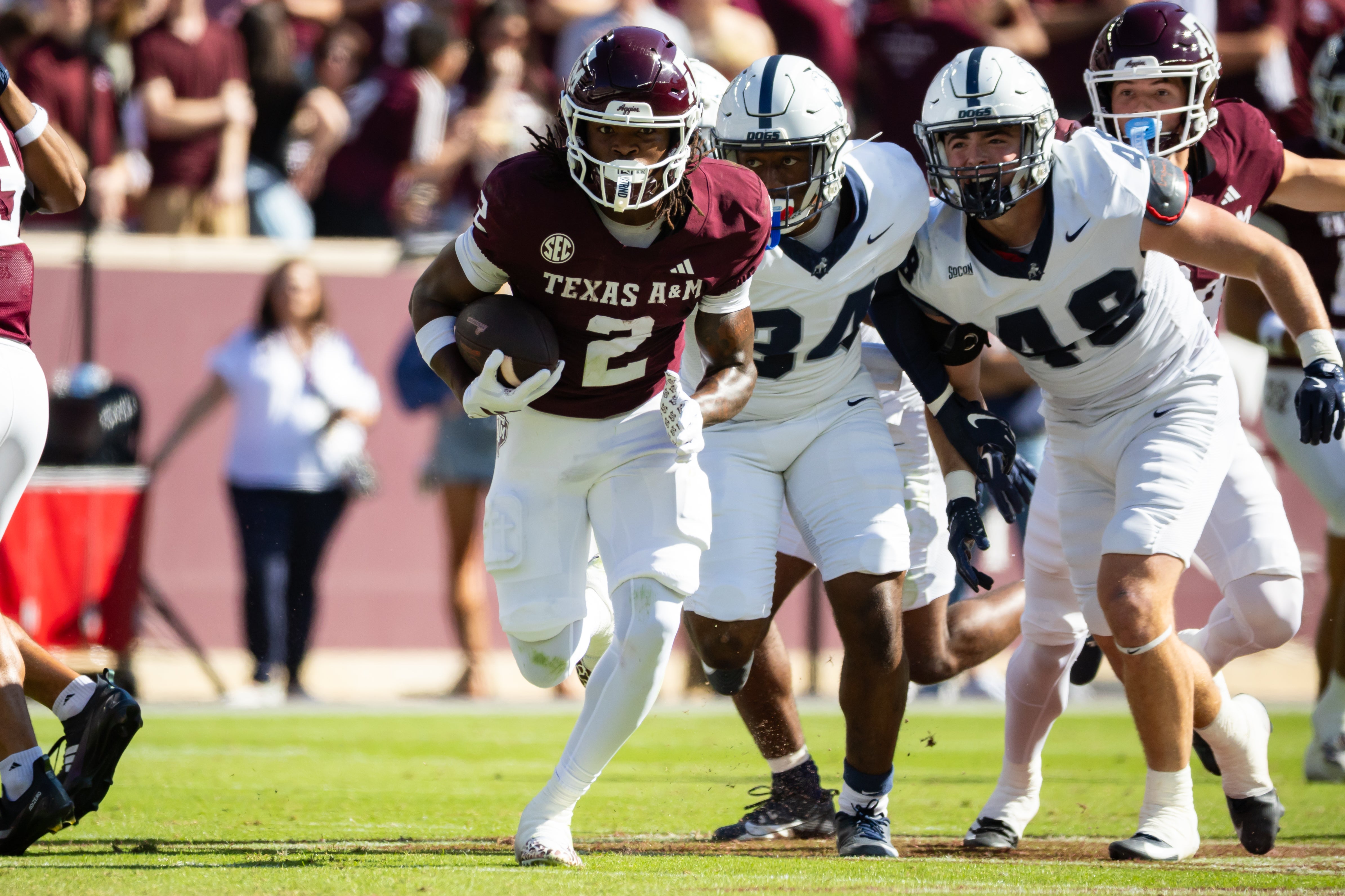 Nov 22, 2025; College Station, Texas, USA; Texas A&M Aggies wide receiver Terry Bussey (2) runs with the ball in the first half of a game against the Samford Bulldogs at Kyle Field.