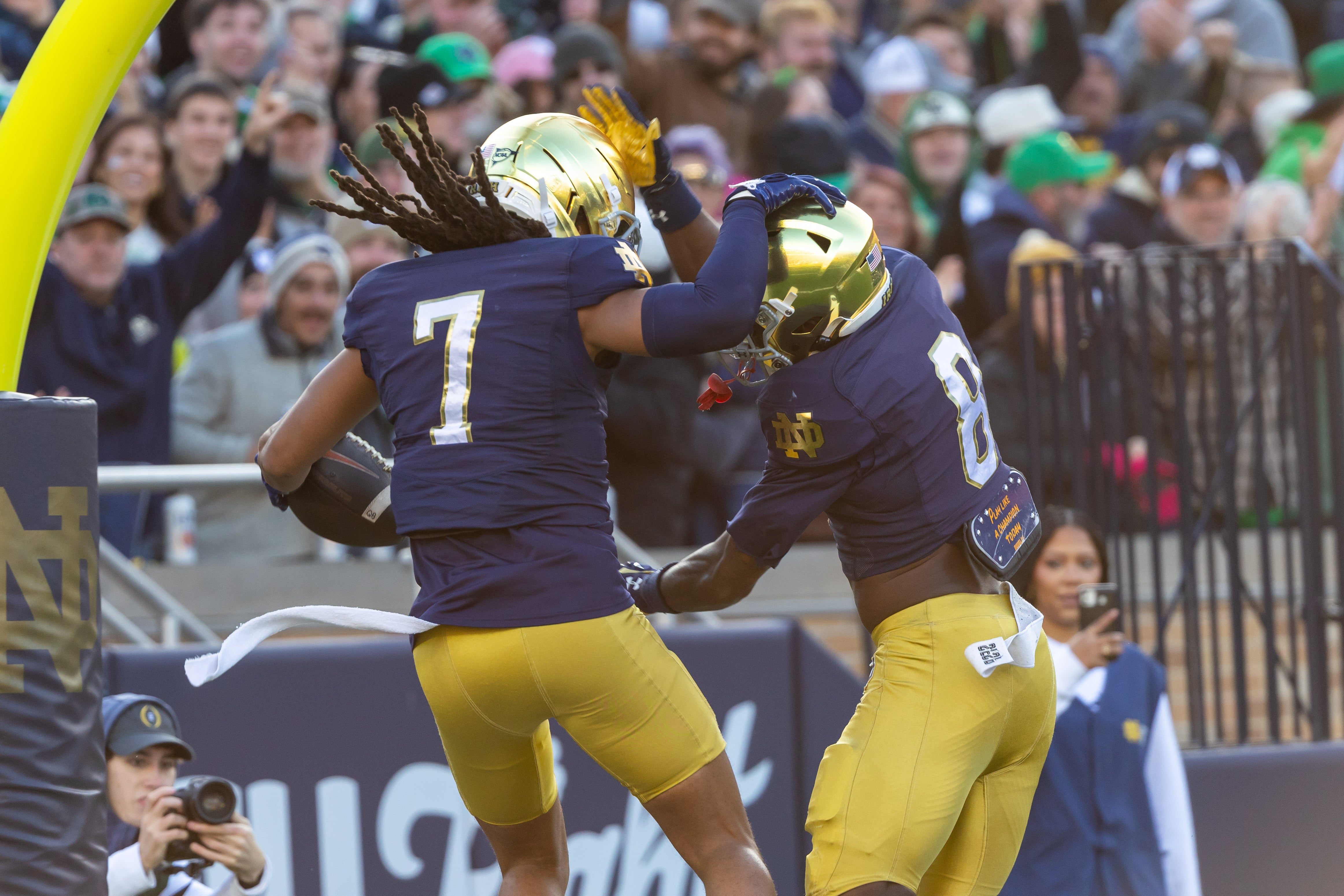 Nov 22, 2025; South Bend, Indiana, USA; Notre Dame Fighting Irish safety Jalen Stroman (7) celebrates scoring on an interception with Notre Dame Fighting Irish safety Adon Shuler (8) against the Syracuse Orange during the first half at Notre Dame Stadium. Mandatory Credit: Michael Caterina-Imagn Images