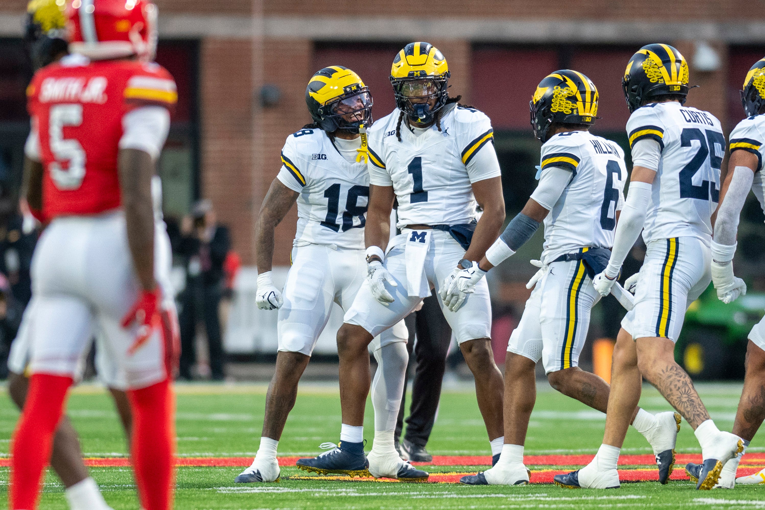 Nov 22, 2025; College Park, Maryland, USA; Michigan Wolverines linebacker Jaishawn Barham (1) reacts after tackle for a loss during the first half against the Maryland Terrapins at SECU Stadium.