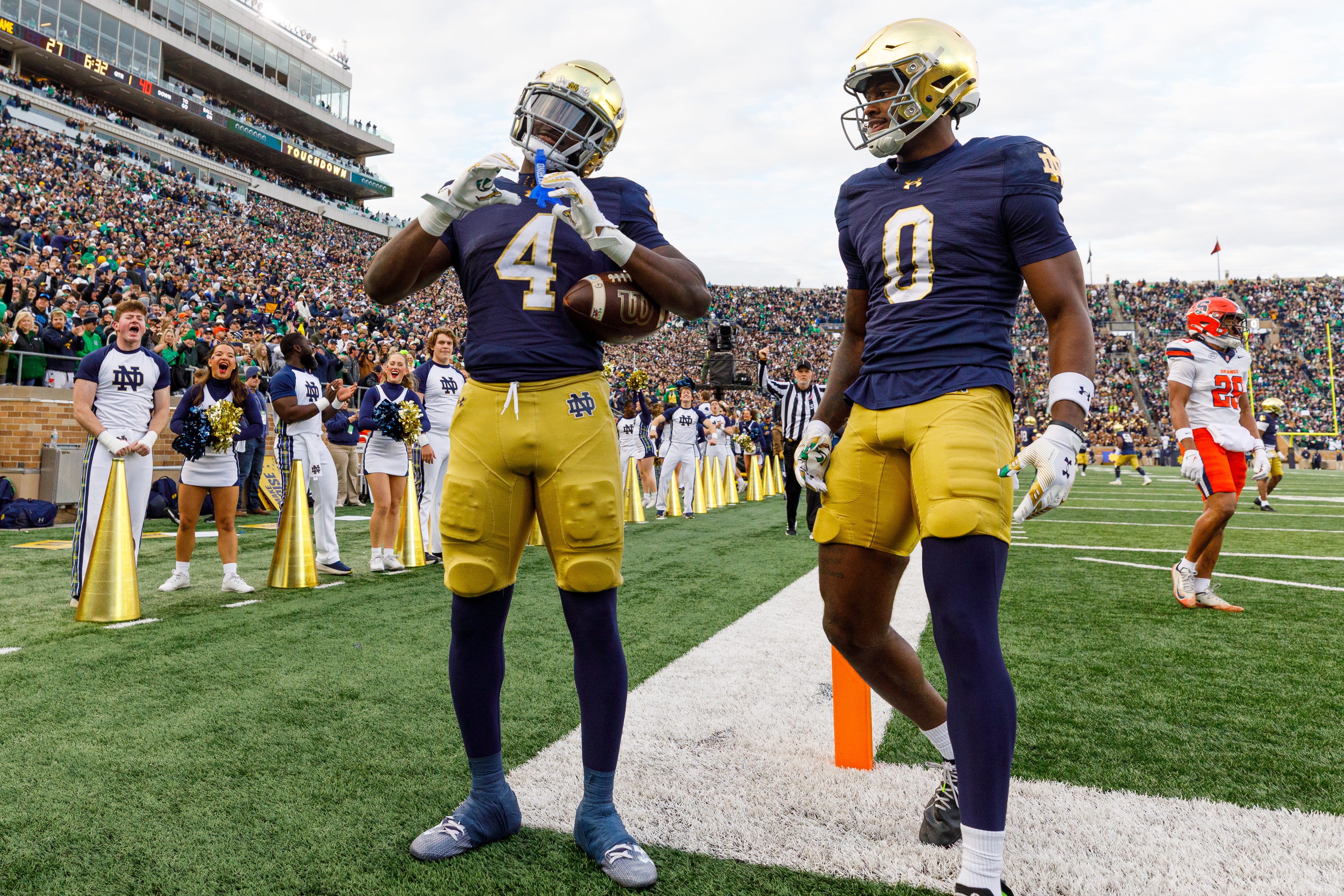 Notre Dame running back Jeremiyah Love (4) makes a heart sign after scoring a touchdown in the first half of a NCAA football game against Syracuse at Notre Dame Stadium on Saturday, Nov. 22, 2025, in South Bend.