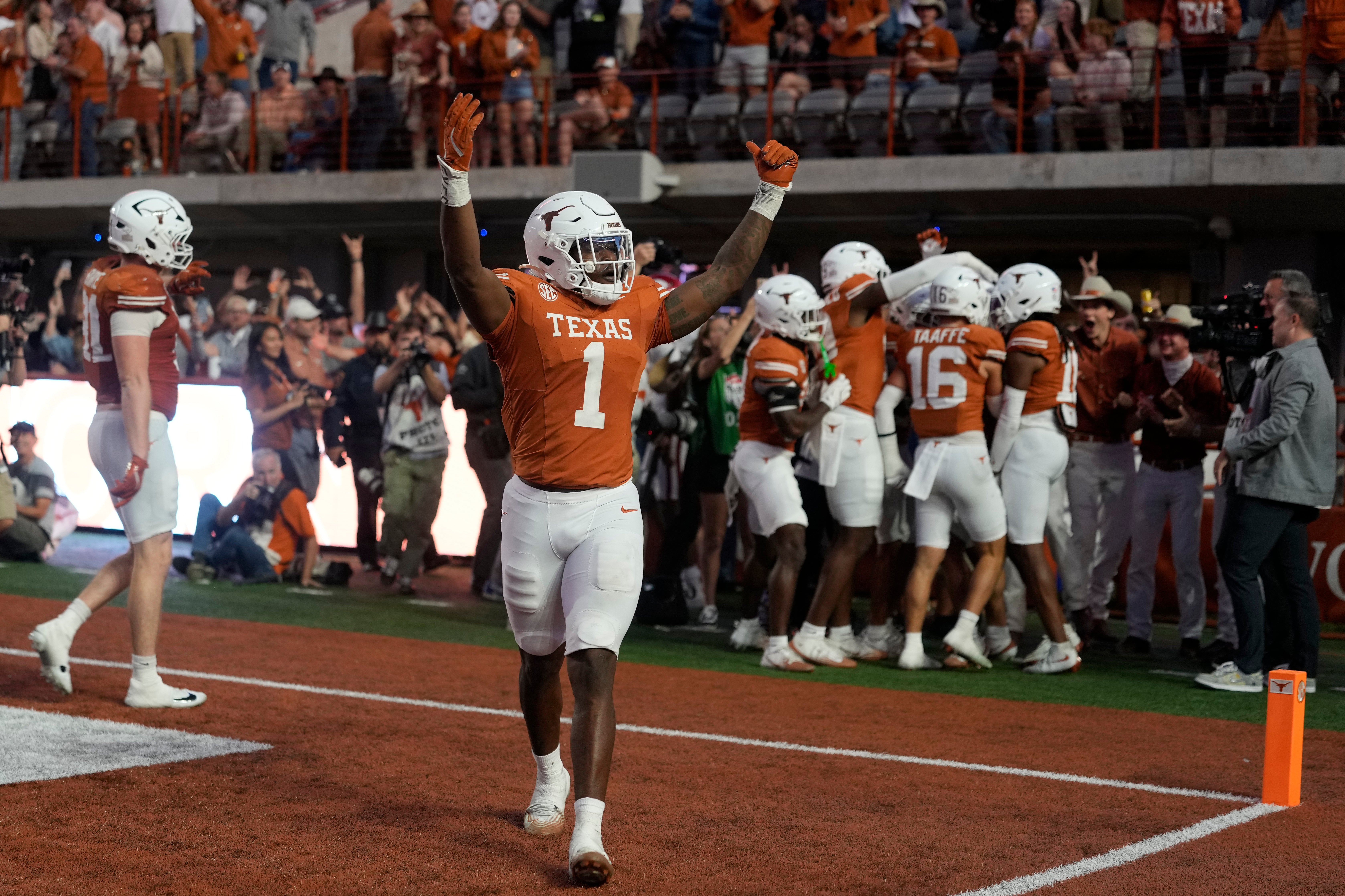 Nov 22, 2025; Austin, Texas, USA; Texas Longhorns defensive lineman Colin Simmons (1) reacts after a fumble was recovered for a touchdown during the second half against the Arkansas Razorbacks at Darrell K Royal-Texas Memorial Stadium. Mandatory Credit: Scott Wachter-Imagn Images