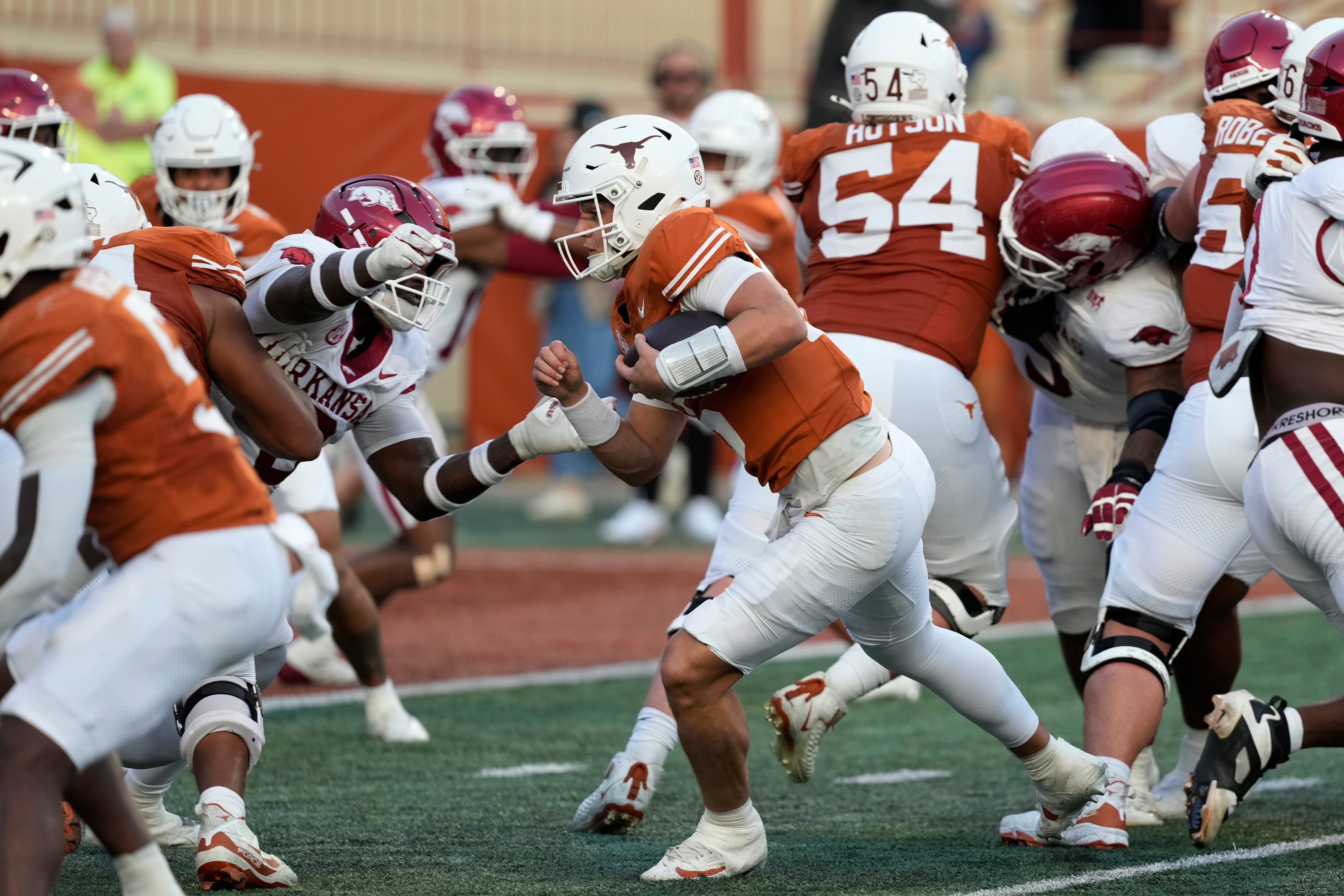 Nov 22, 2025; Austin, Texas, USA; Texas Longhorns quarterback Arch Manning (16) keeps the ball and runs for a touchdown during the second half against the Arkansas Razorbacks at Darrell K Royal-Texas Memorial Stadium. Mandatory Credit: Scott Wachter-Imagn Images