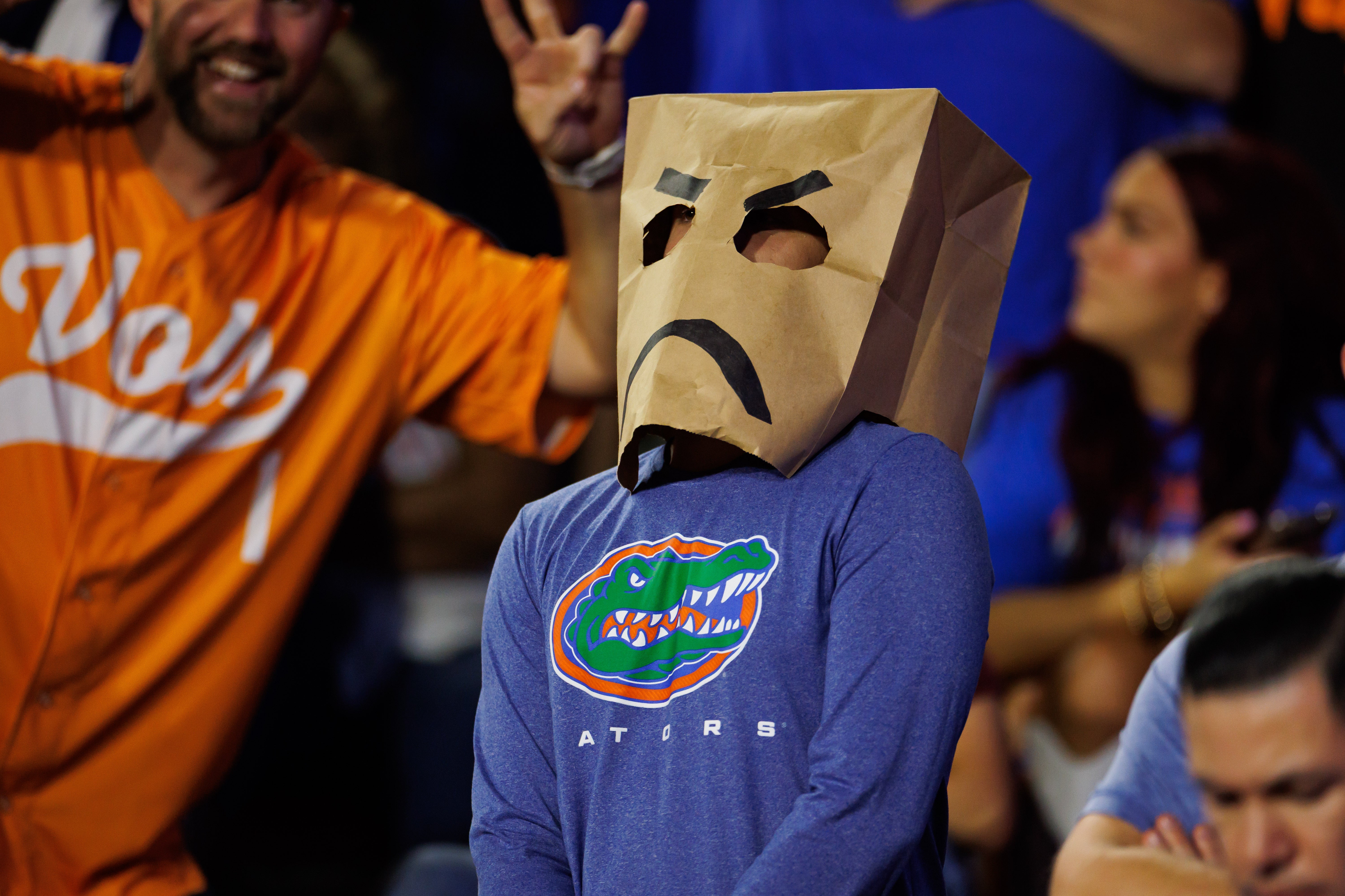 Nov 22, 2025; Gainesville, Florida, USA; A Florida Gators fan wears a bag over his head against the Tennessee Volunteers during the second half at Ben Hill Griffin Stadium.