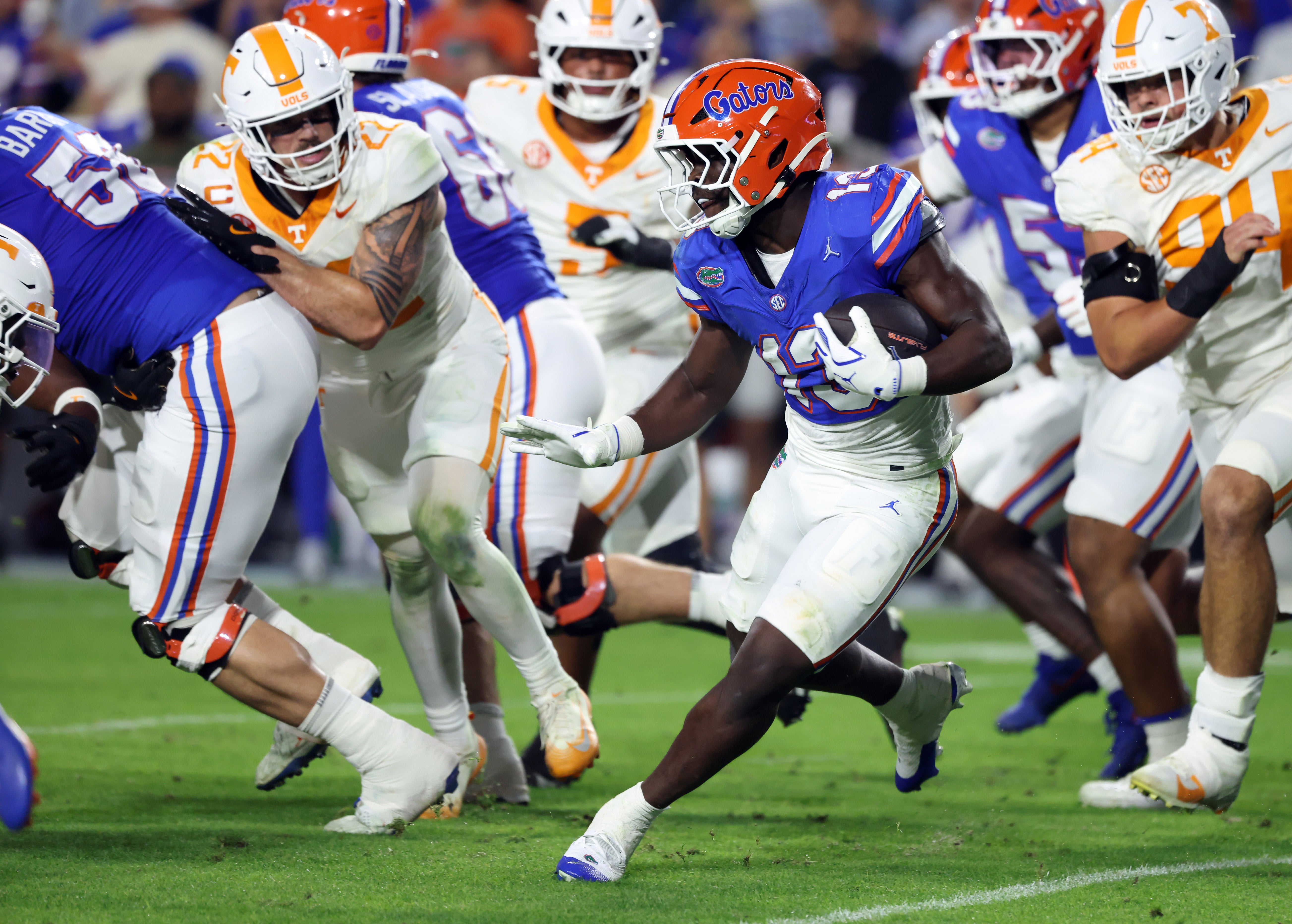 Nov 22, 2025; Gainesville, Florida, USA;Florida Gators running back Jadan Baugh (13) runs with the ball against the Tennessee Volunteers during the second half at Ben Hill Griffin Stadium.