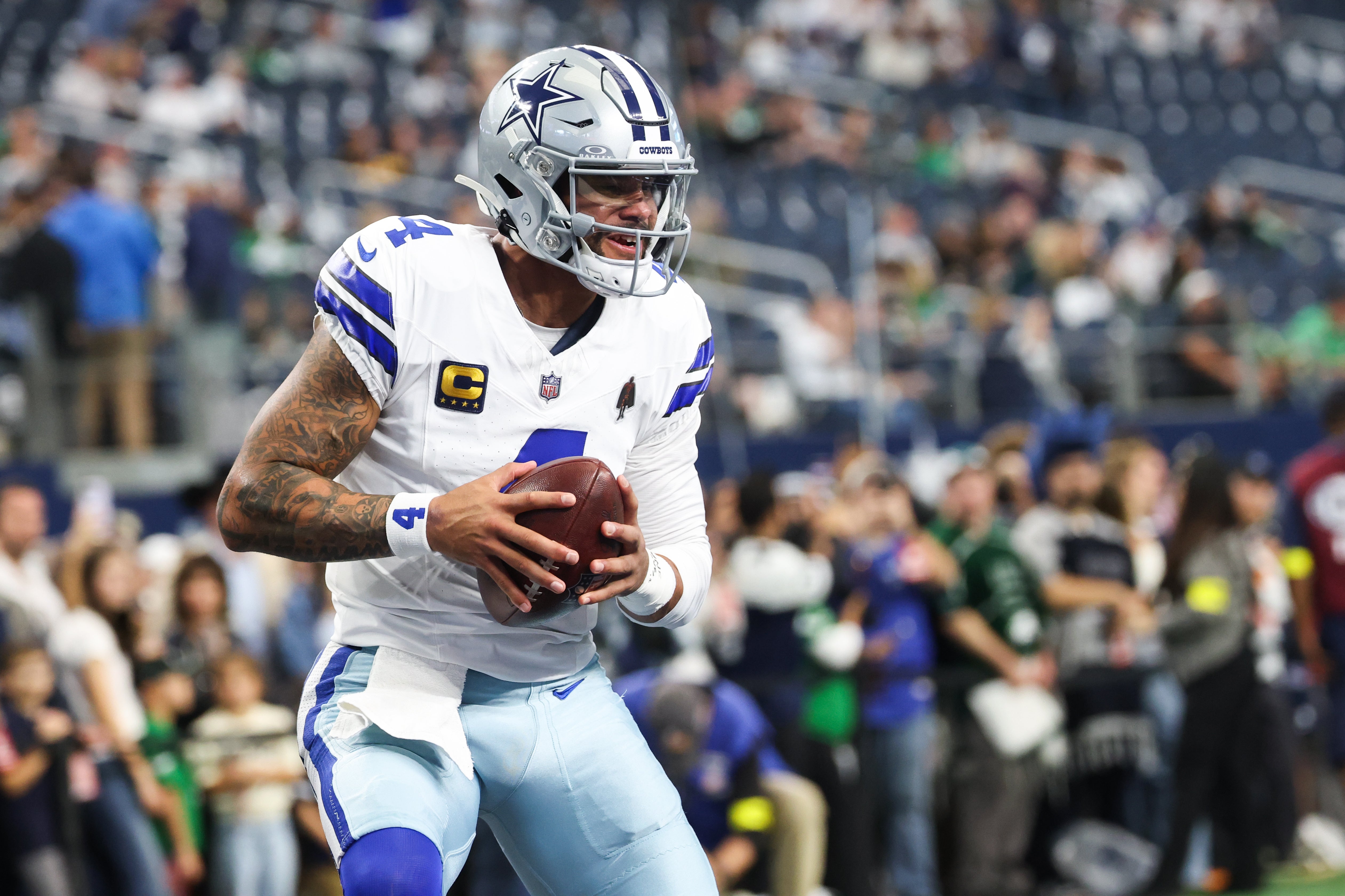 Nov 23, 2025; Arlington, Texas, USA; Dallas Cowboys quarterback Dak Prescott (4) warms up before the game against the Philadelphia Eagles at AT&T Stadium.