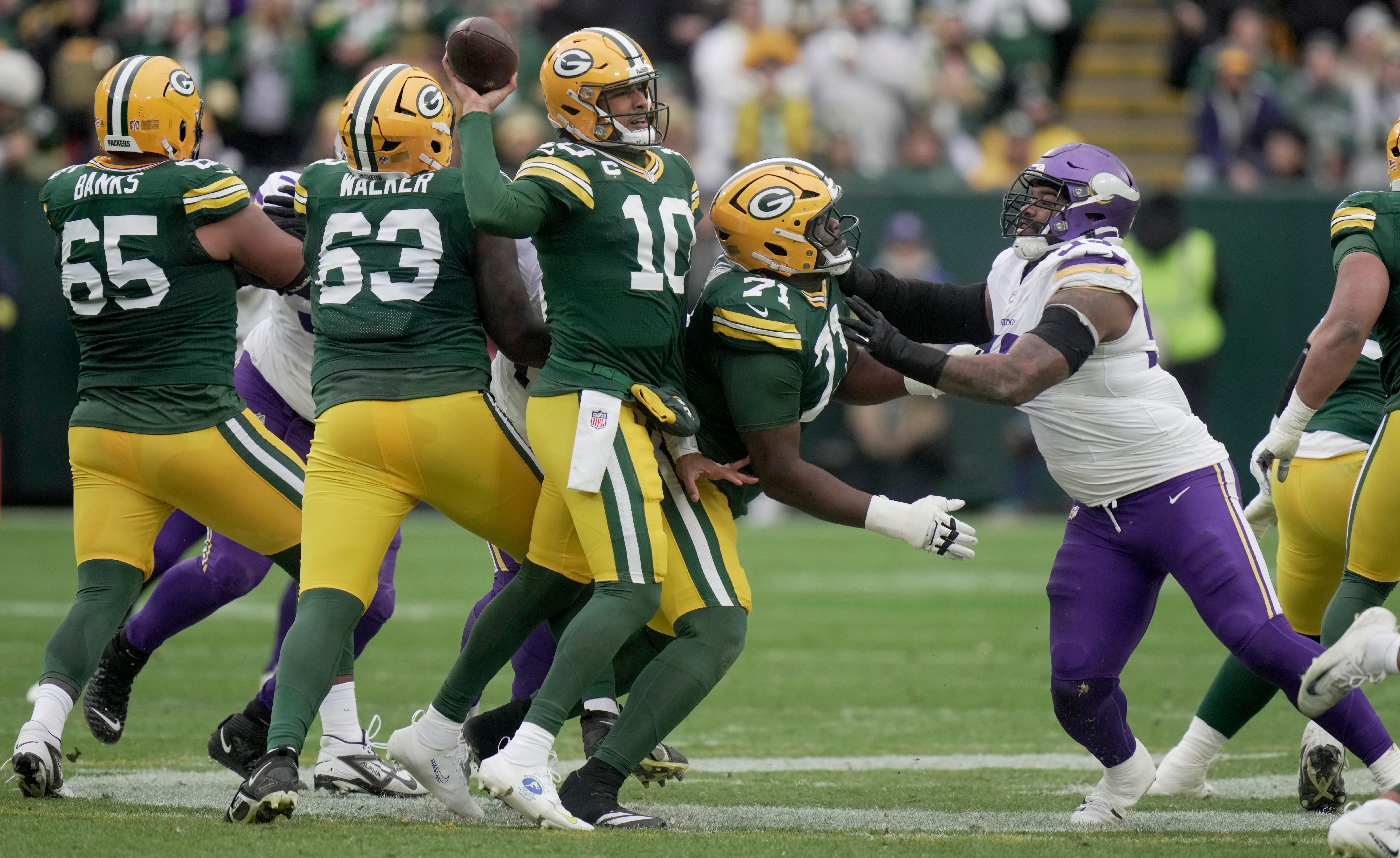 Green Bay Packers quarterback Jordan Love (10) completes a pass under pressure during the third quarter of their game against the Minnesota Vikings Sunday, November 23, 2025 at Lambeau Field in Green Bay, Wisconsin.