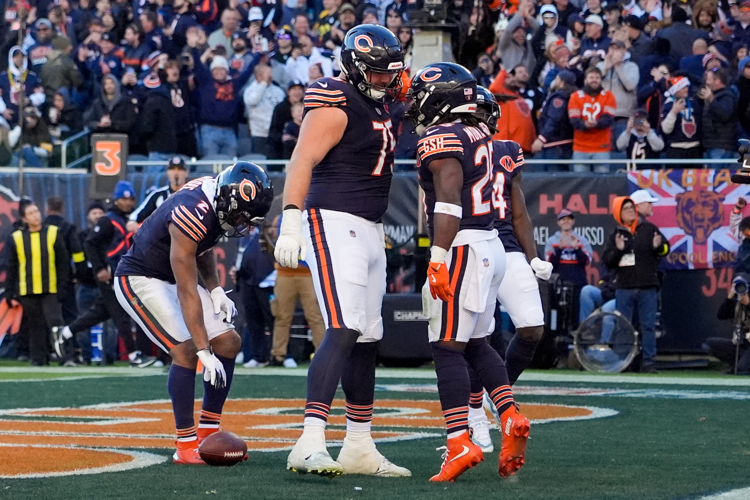 Nov 23, 2025; Chicago, Illinois, USA; Chicago Bears running back Kyle Monangai (25) reacts with offensive tackle Ozzy Trapilo (75) after scoring a touchdown against the Pittsburgh Steelers during the second half at Soldier Field.