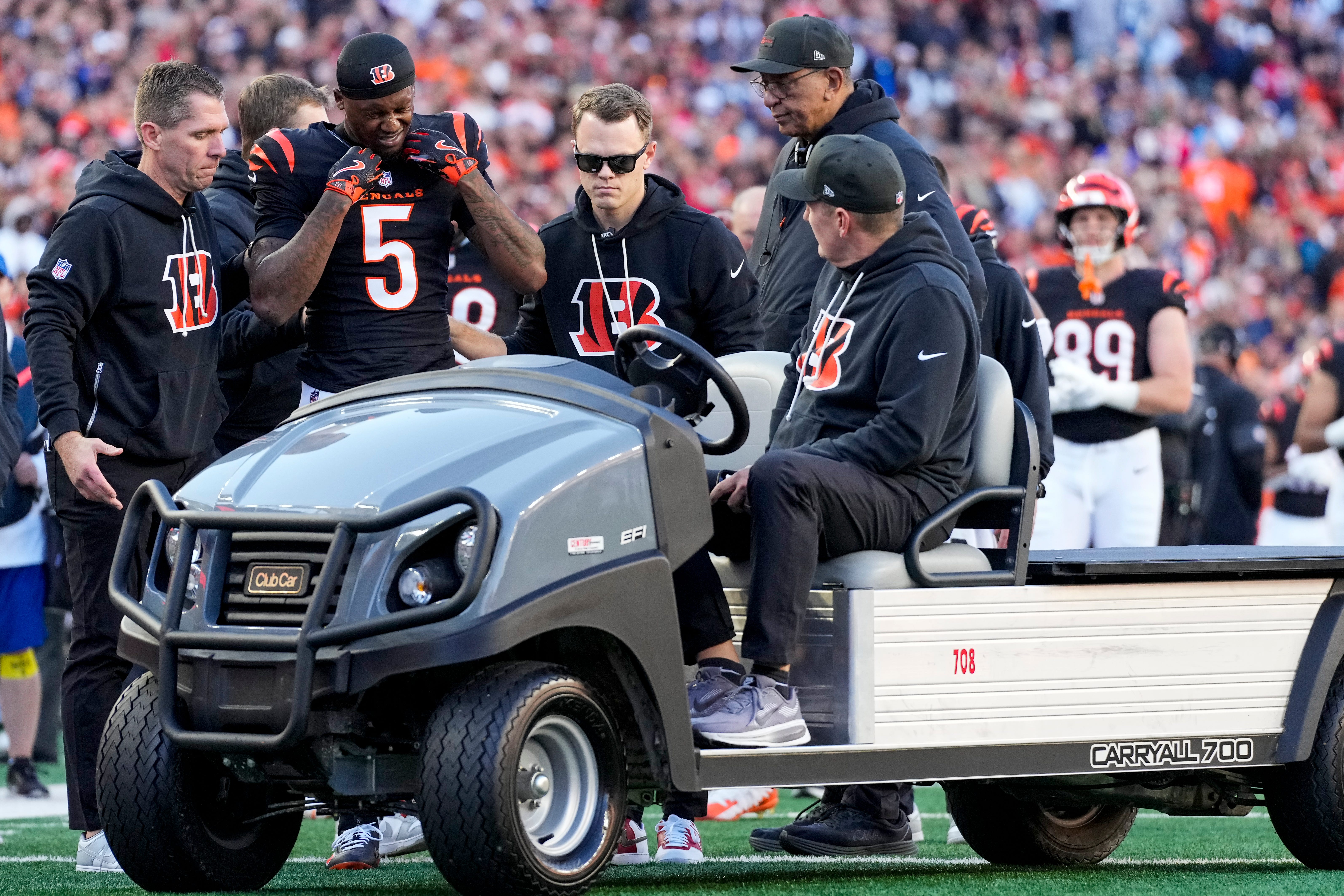 Cincinnati Bengals wide receiver Tee Higgins (5) is carted off of the field after suffering a concussion on a play in the fourth quarter of the NFL Week 12 game between the Cincinnati Bengals and the New England Patriots at Paycor Stadium in downtown Cincinnati on Sunday, Nov. 23, 2025. The Bengals fall to 3-8 with a 26-20 loss at home.