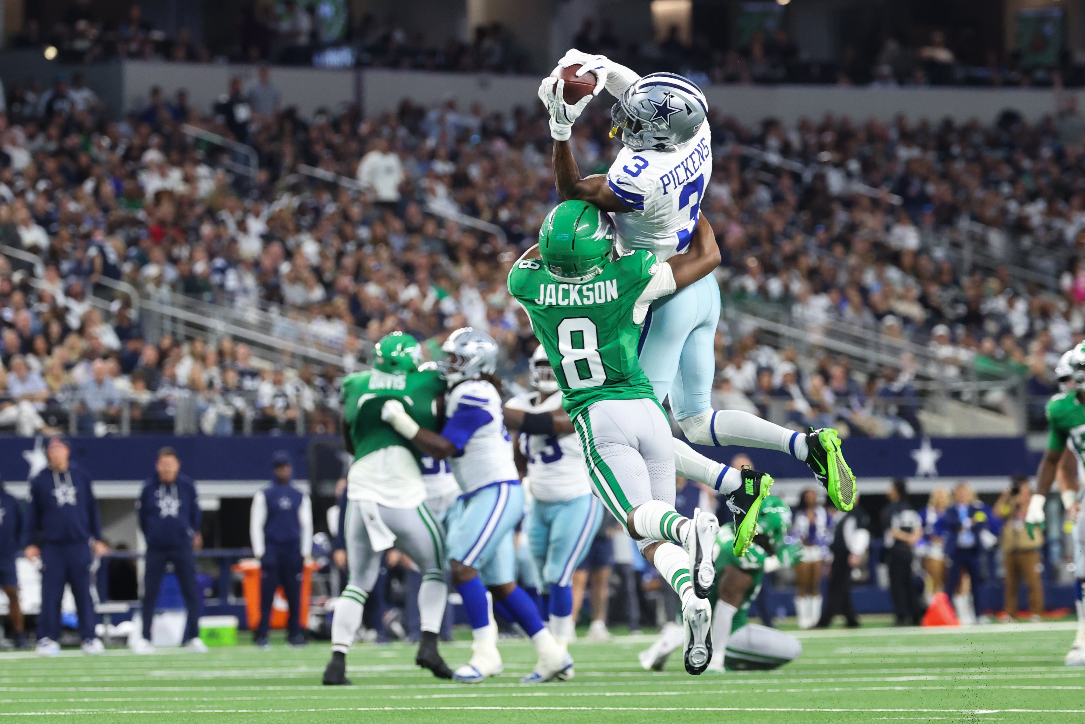 Nov 23, 2025; Arlington, Texas, USA; Dallas Cowboys wide receiver George Pickens (3) catches the ball while being defended by Philadelphia Eagles cornerback Adoree' Jackson (8) at AT&T Stadium.