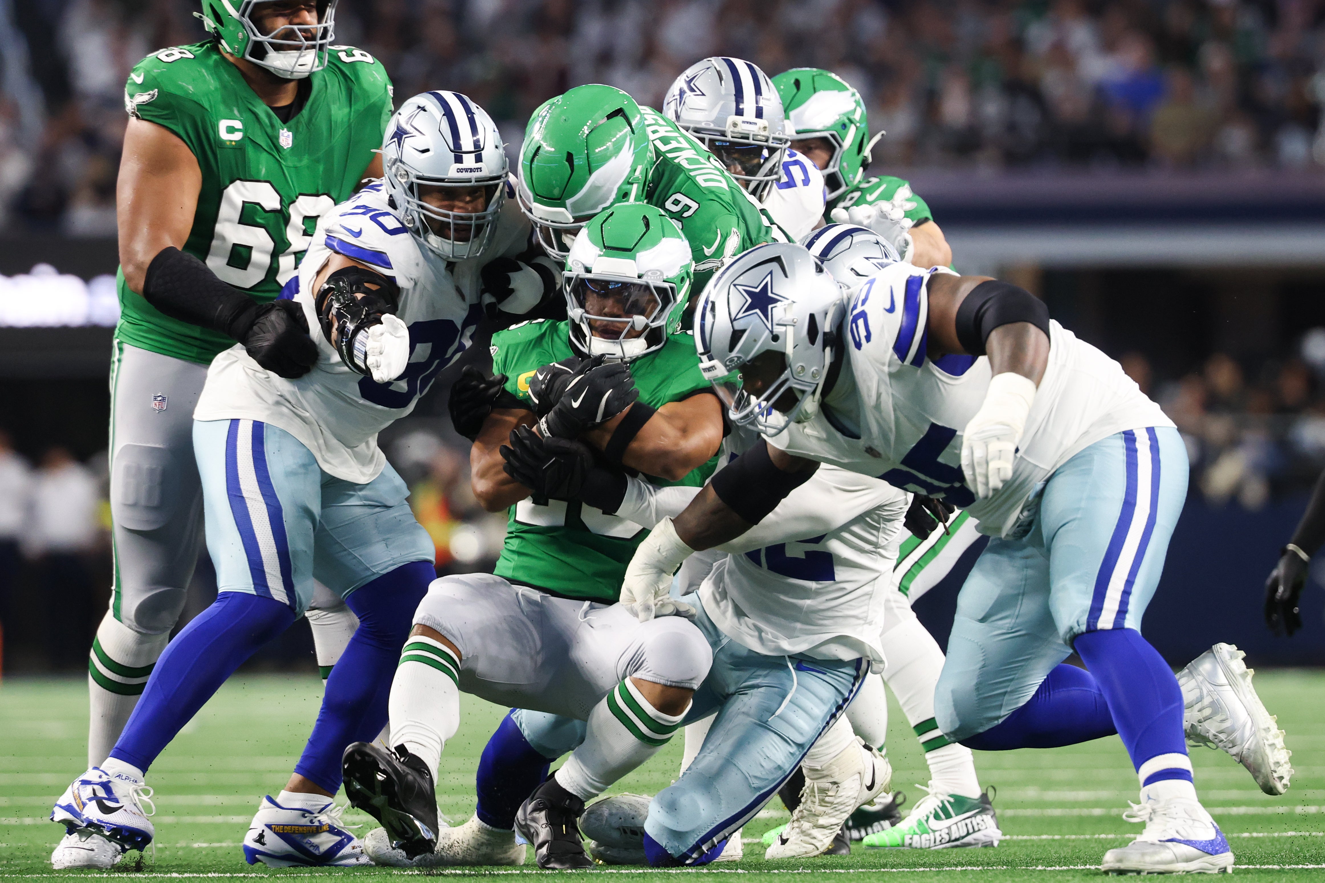 Nov 23, 2025; Arlington, Texas, USA; Philadelphia Eagles running back Saquon Barkley (26) is brought down in the second quarter against the Dallas Cowboys at AT&T Stadium.