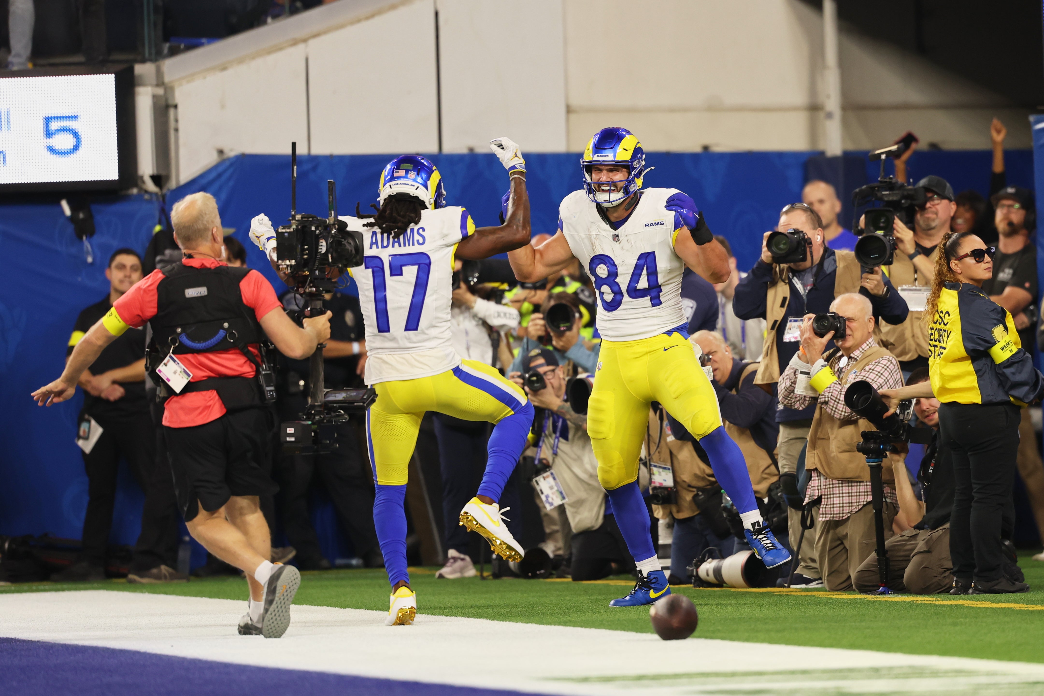 Nov 23, 2025; Inglewood, California, USA; Los Angeles Rams tight end Colby Parkinson (84) celebrates with wide receiver Davante Adams (17) after catching a touchdown pass against the Tampa Bay Buccaneers during the second quarter at SoFi Stadium.