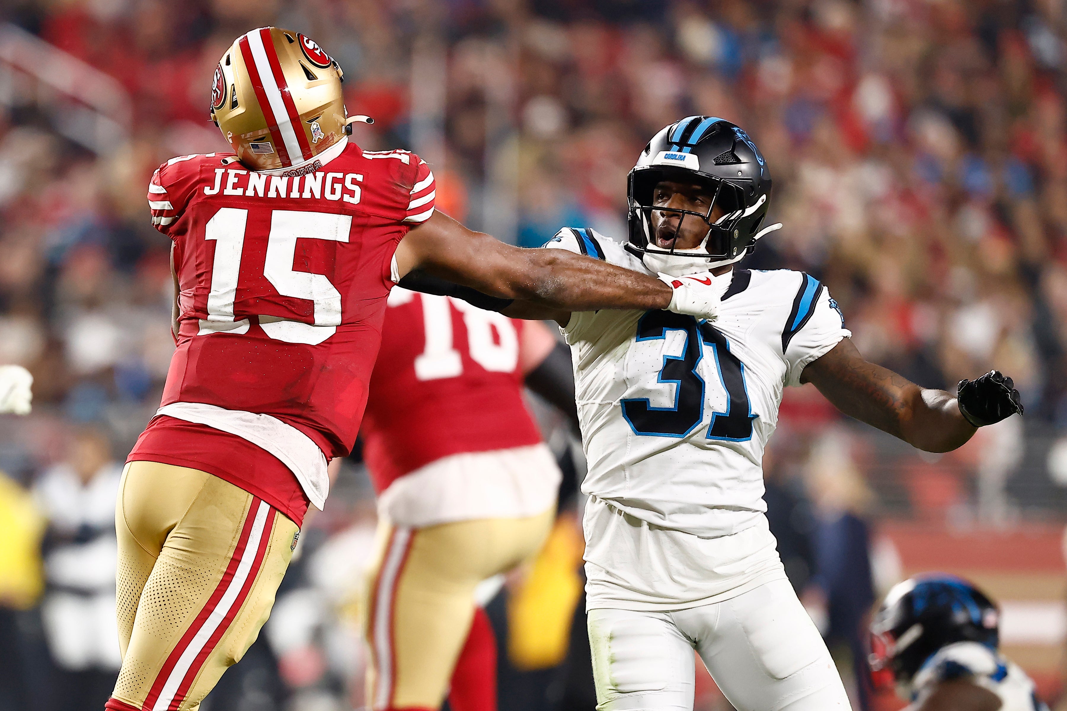 Nov 24, 2025; Santa Clara, California, USA; San Francisco 49ers wide receiver Jauan Jennings (15) and Carolina Panthers cornerback Corey Thornton (31) shove each other during the second half at Levi's Stadium.