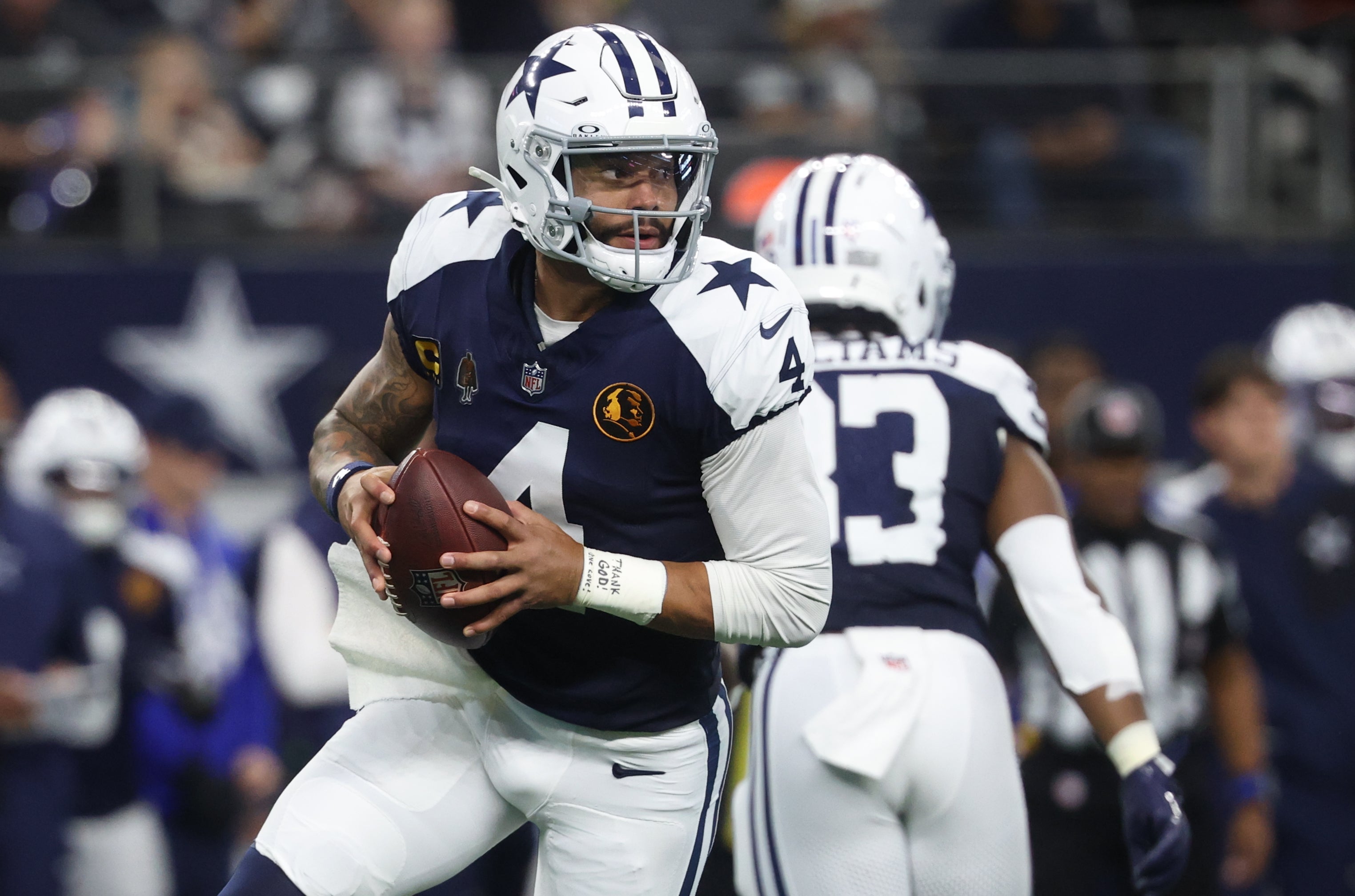 Nov 27, 2025; Arlington, Texas, USA; Dallas Cowboys quarterback Dak Prescott (4) looks to throw the ball against the Kansas City Chiefs during the first quarter at AT&T Stadium.