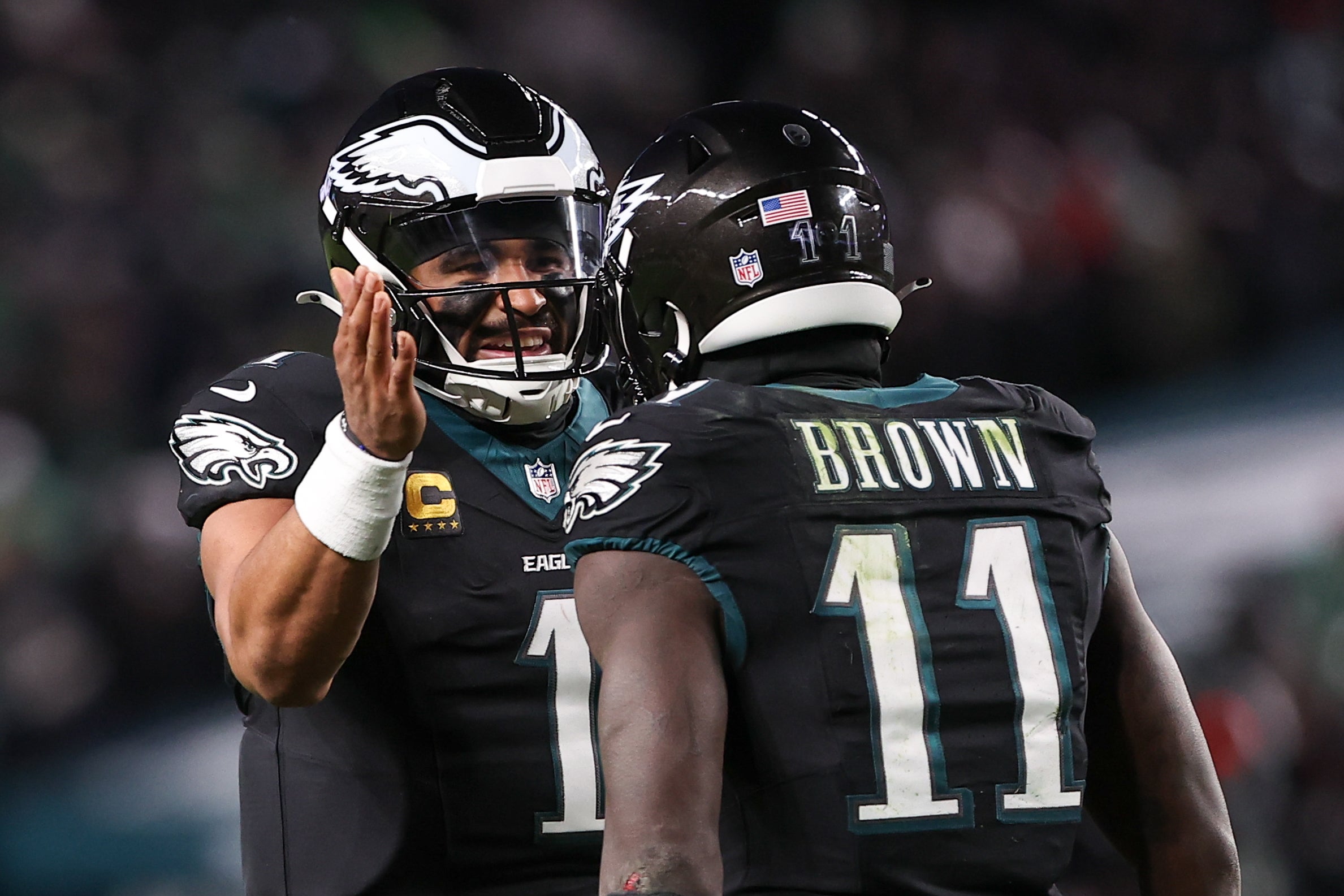 Nov 28, 2025; Philadelphia, Pennsylvania, USA; Philadelphia Eagles quarterback Jalen Hurts (1) and wide receiver A.J. Brown (11) celebrate a touchdown against the Chicago Bears during the third quarter of the game at Lincoln Financial Field