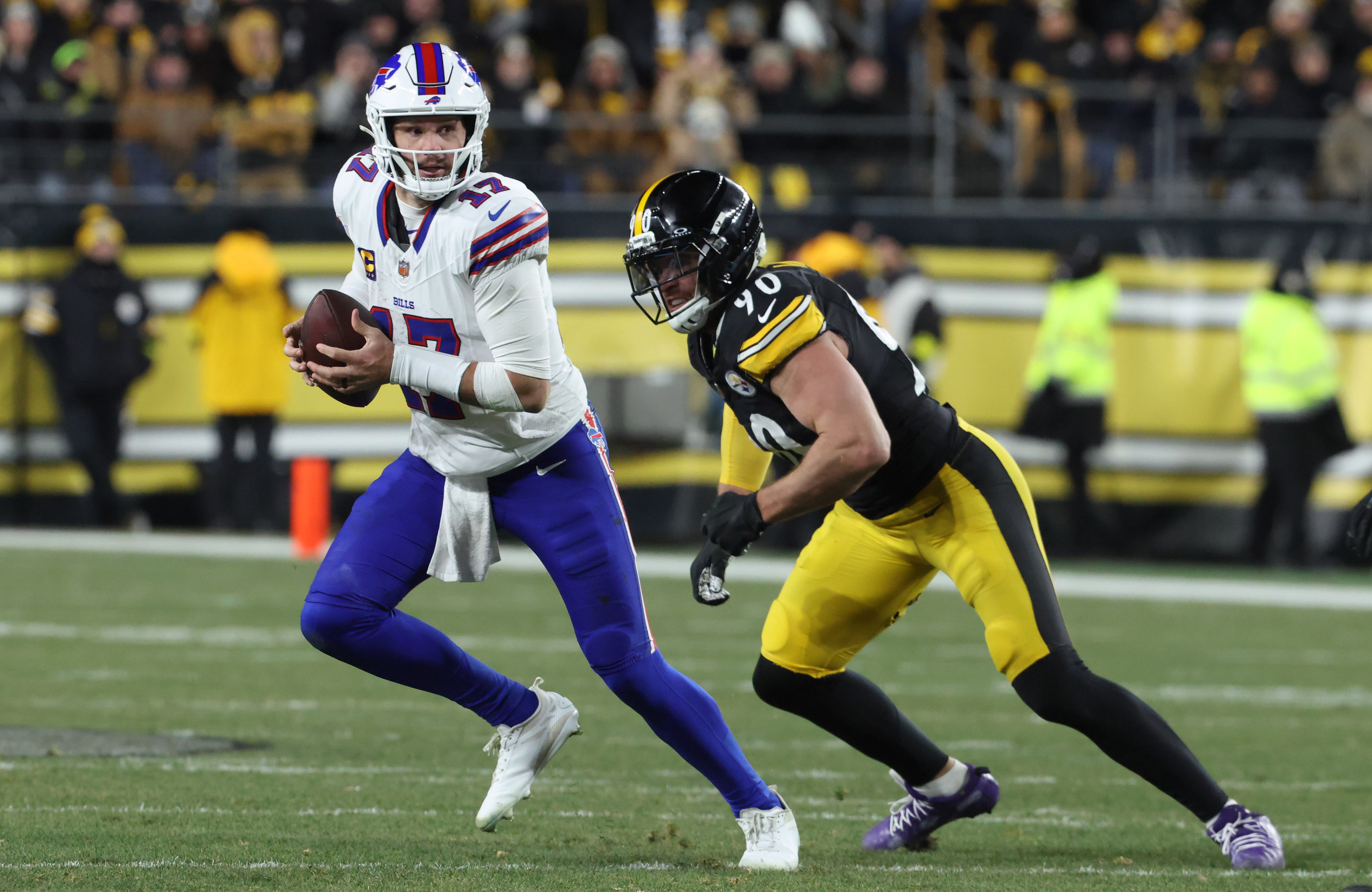 Nov 30, 2025; Pittsburgh, Pennsylvania, USA; Buffalo Bills quarterback Josh Allen (17) looks to pass as Pittsburgh Steelers linebacker T.J. Watt (90) defends during the second quarter at Acrisure Stadium.