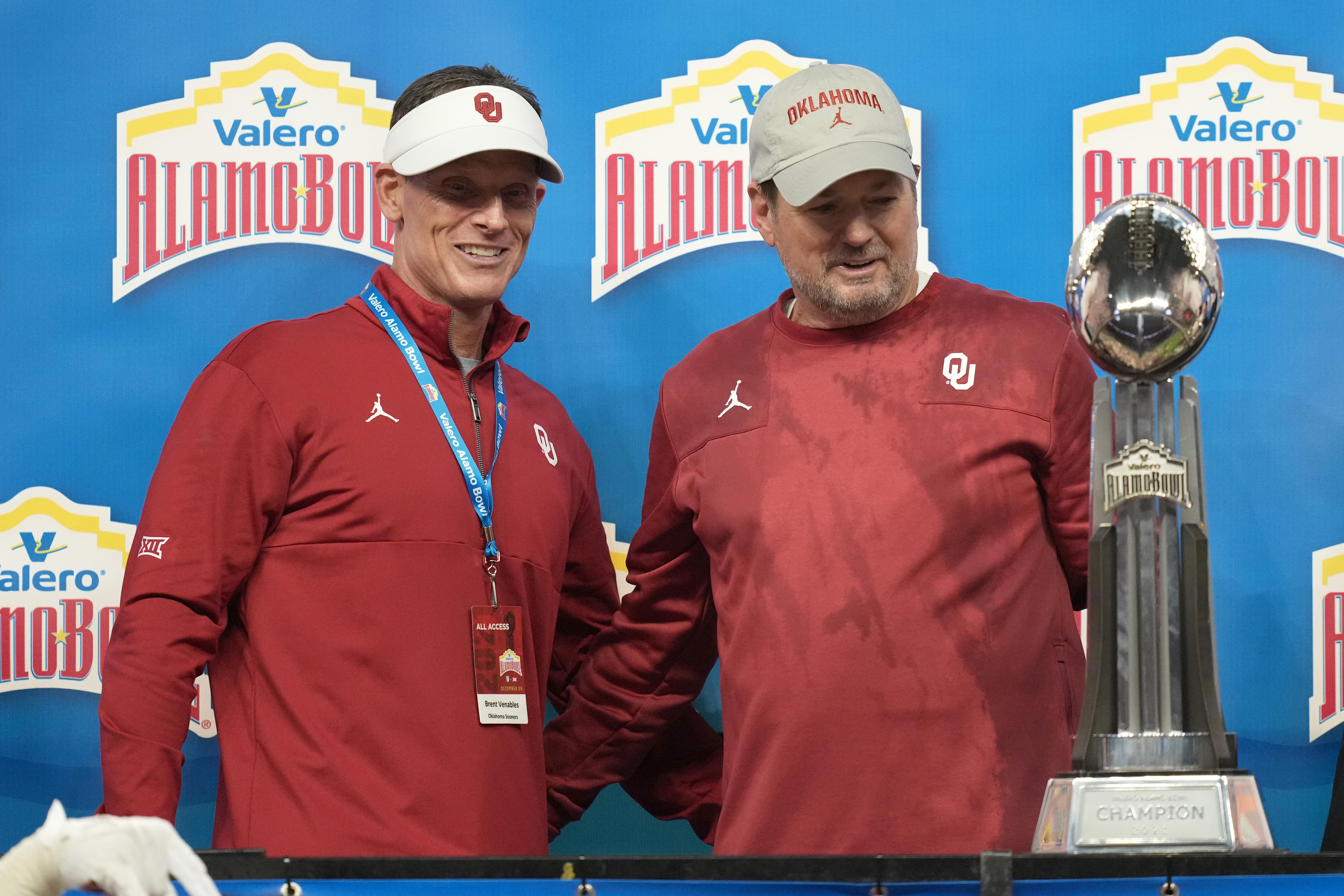 Oklahoma Sooners head coach Brent Venables and former head coach Bob Stoops
