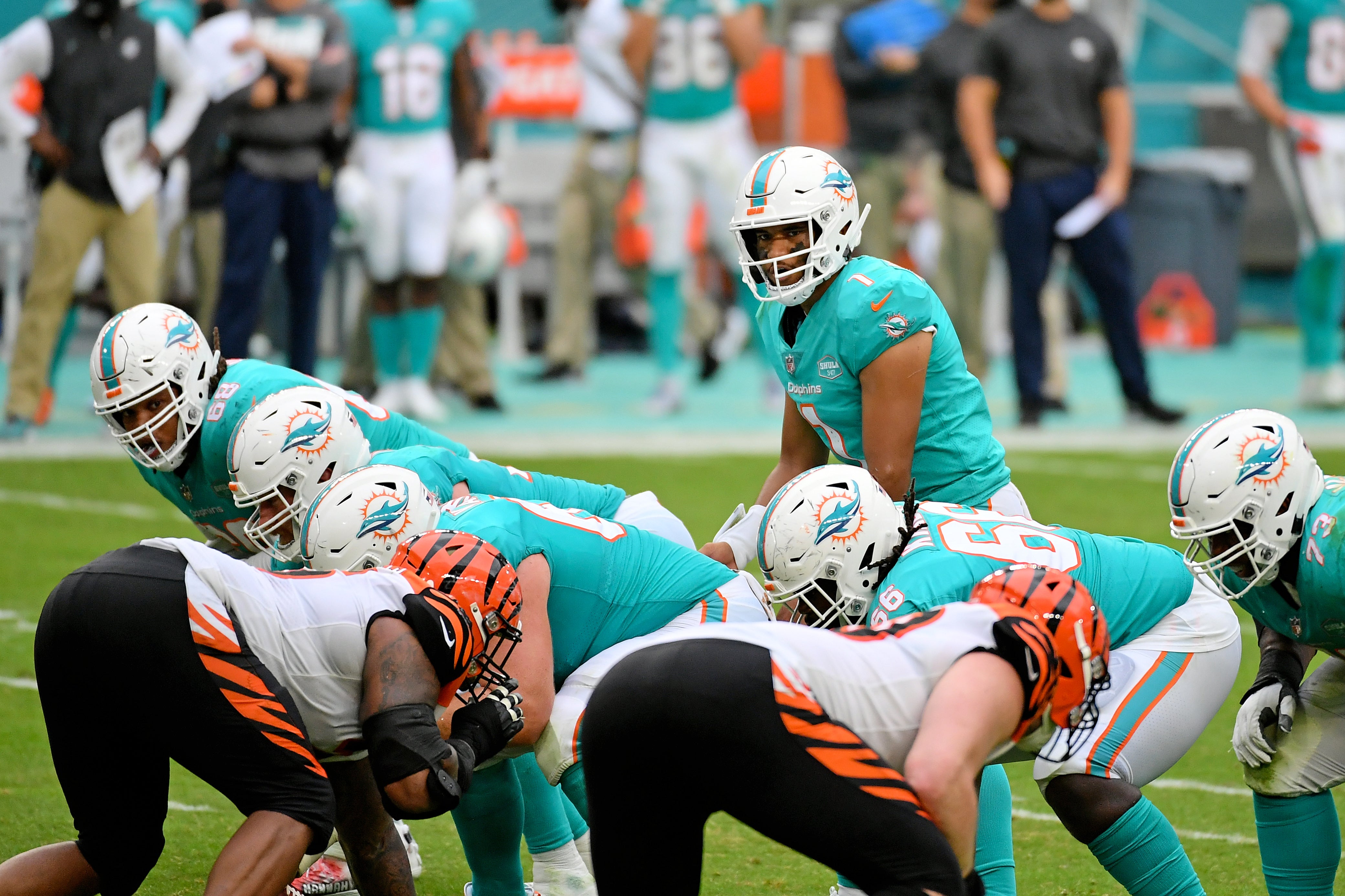 Dec 6, 2020; Miami Gardens, Florida, USA; Miami Dolphins quarterback Tua Tagovailoa (1) looks over the offensive line prior to a play against the Cincinnati Bengals during the second half at Hard Rock Stadium.