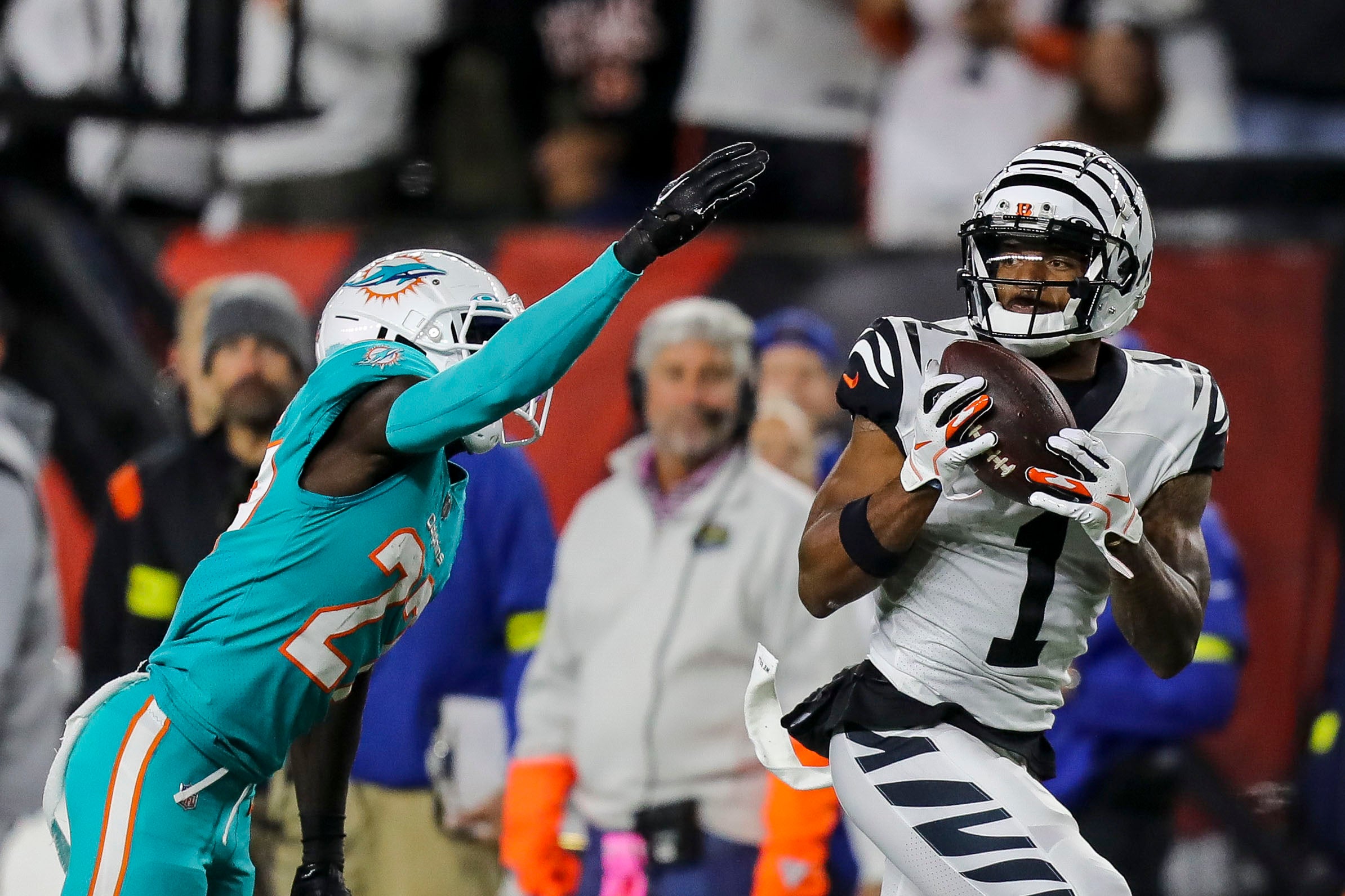 Sep 29, 2022; Cincinnati, Ohio, USA; Cincinnati Bengals wide receiver Ja'Marr Chase (1) catches a pass against Miami Dolphins cornerback Keion Crossen (27) in the second half at Paycor Stadium.