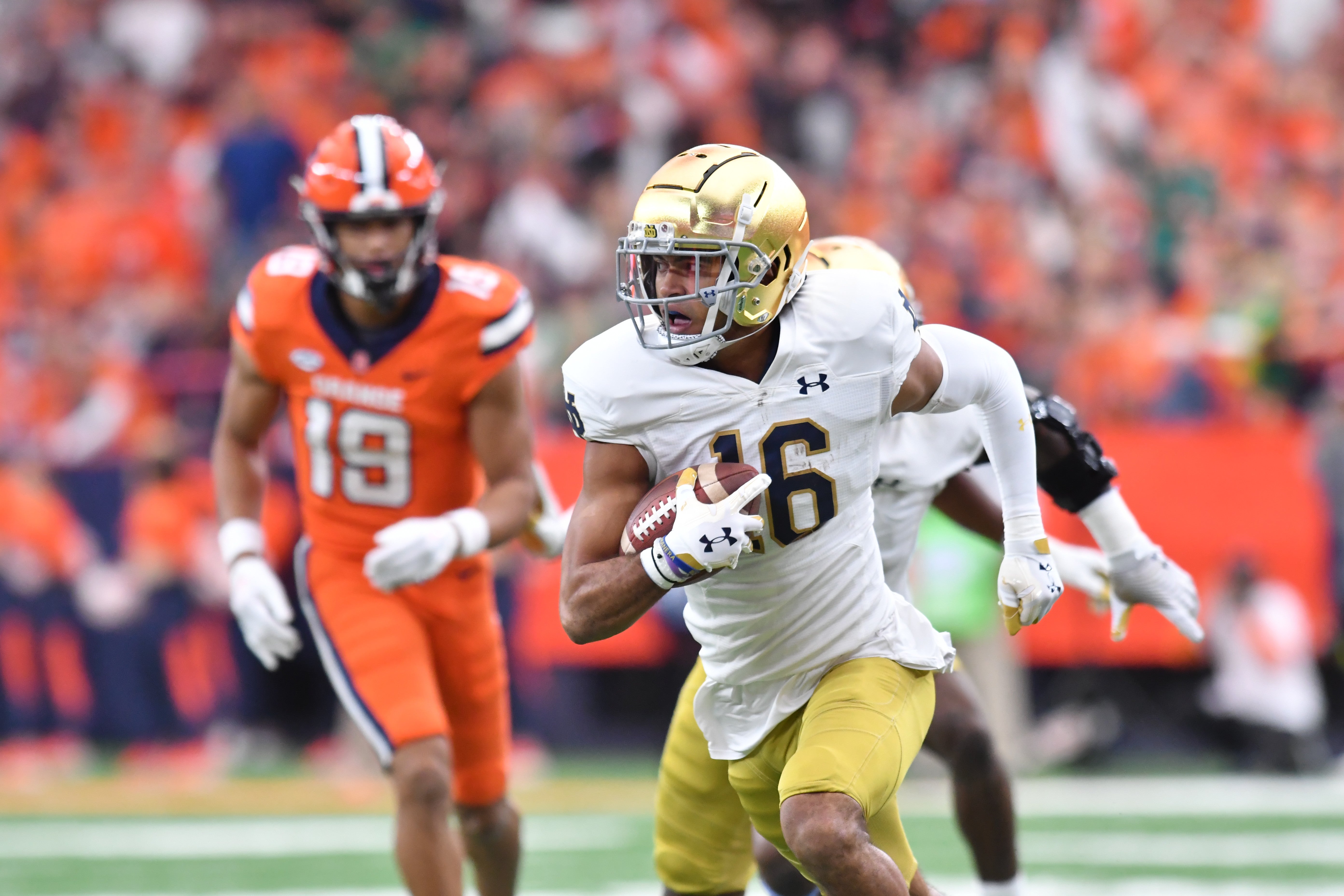Oct 29, 2022; Syracuse, New York, USA; Notre Dame Fighting Irish safety Brandon Joseph (16) returns an interception for a touchdown against the Syracuse Orange in the first quarter at JMA Wireless Dome. Mandatory Credit: Mark Konezny-USA TODAY Sports