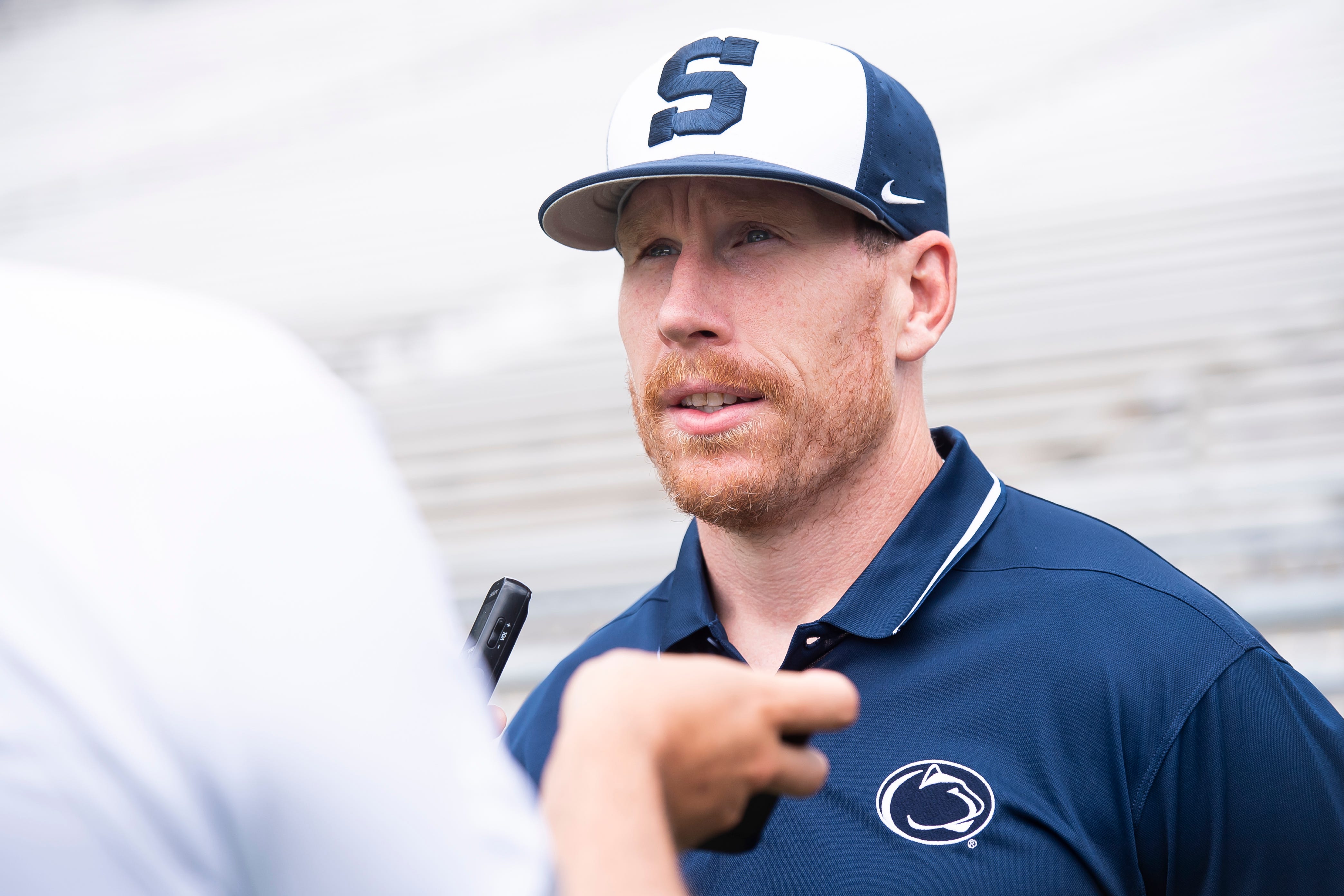 Penn State football offensive line coach Phil Trautwein talks to a reporter during football media day at Beaver Stadium on Sunday, August 6, 2023, in State College.