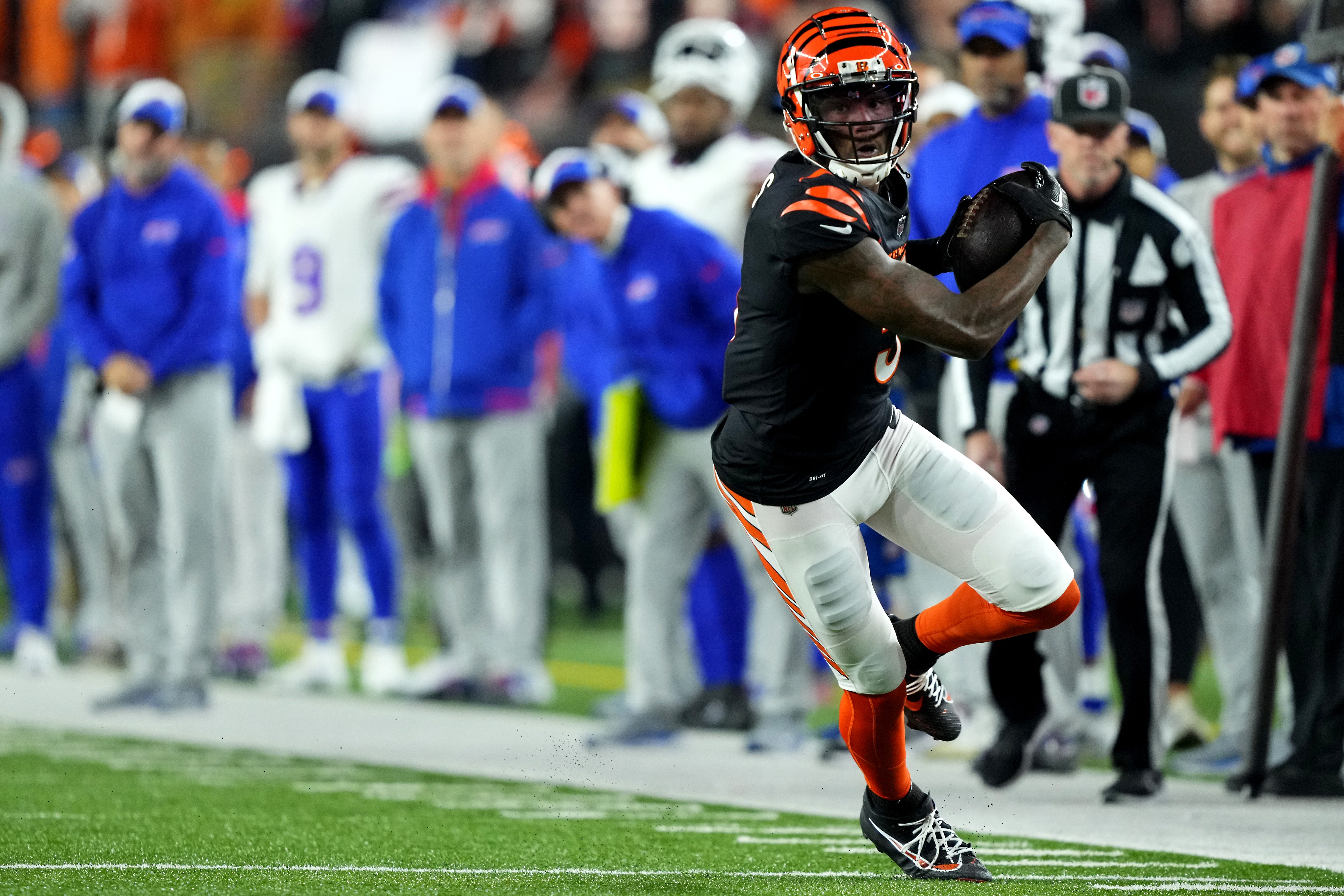 Cincinnati Bengals wide receiver Tee Higgins (5) turns downfield after completing a catch in the first quarter during a Week 9 NFL football game between the Buffalo Bills and the Cincinnati Bengals, Sunday, Nov. 5, 2023, at Paycor Stadium in Cincinnati.
