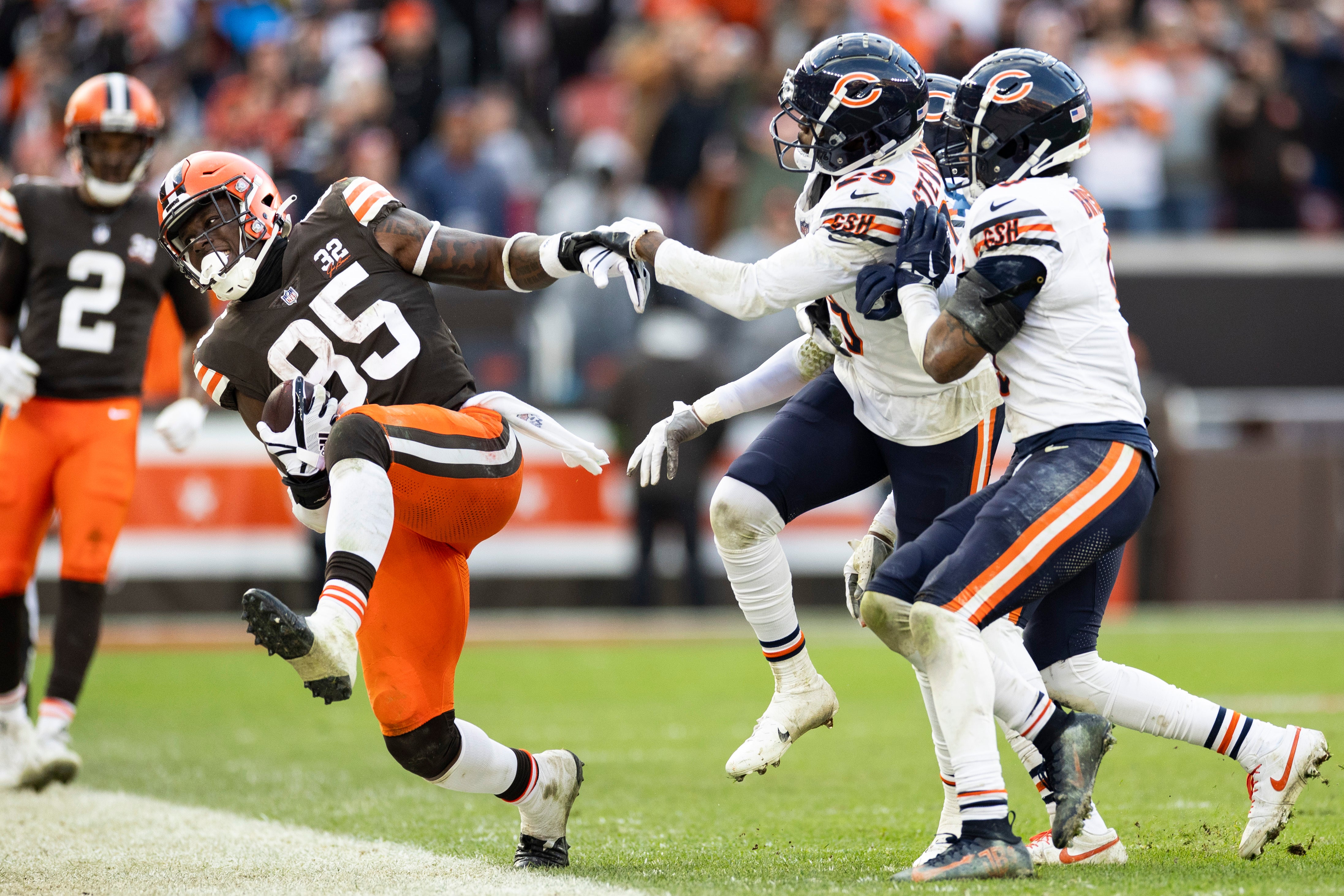 Dec 17, 2023; Cleveland, Ohio, USA; Cleveland Browns tight end David Njoku (85) is pushed out of bounds by Chicago Bears cornerback Tyrique Stevenson (29) during the fourth quarter at Cleveland Browns Stadium.