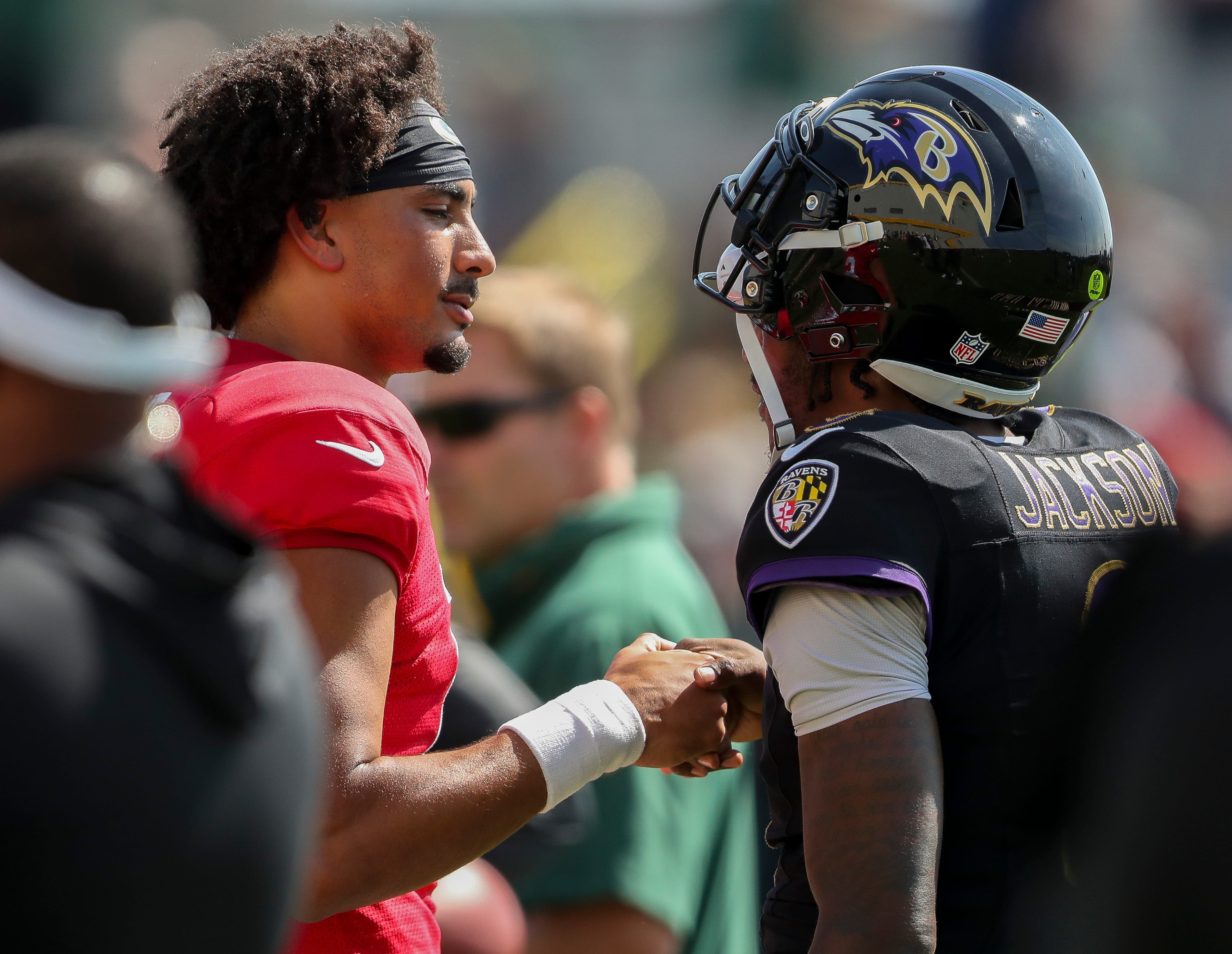 Green Bay Packers quarterback Jordan Love (10) shakes hands with Baltimore Ravens quarterback Lamar Jackson (8) during a joint practice on Thursday, August 22, 2024, at Ray Nitschke Field in Ashwaubenon, Wis.