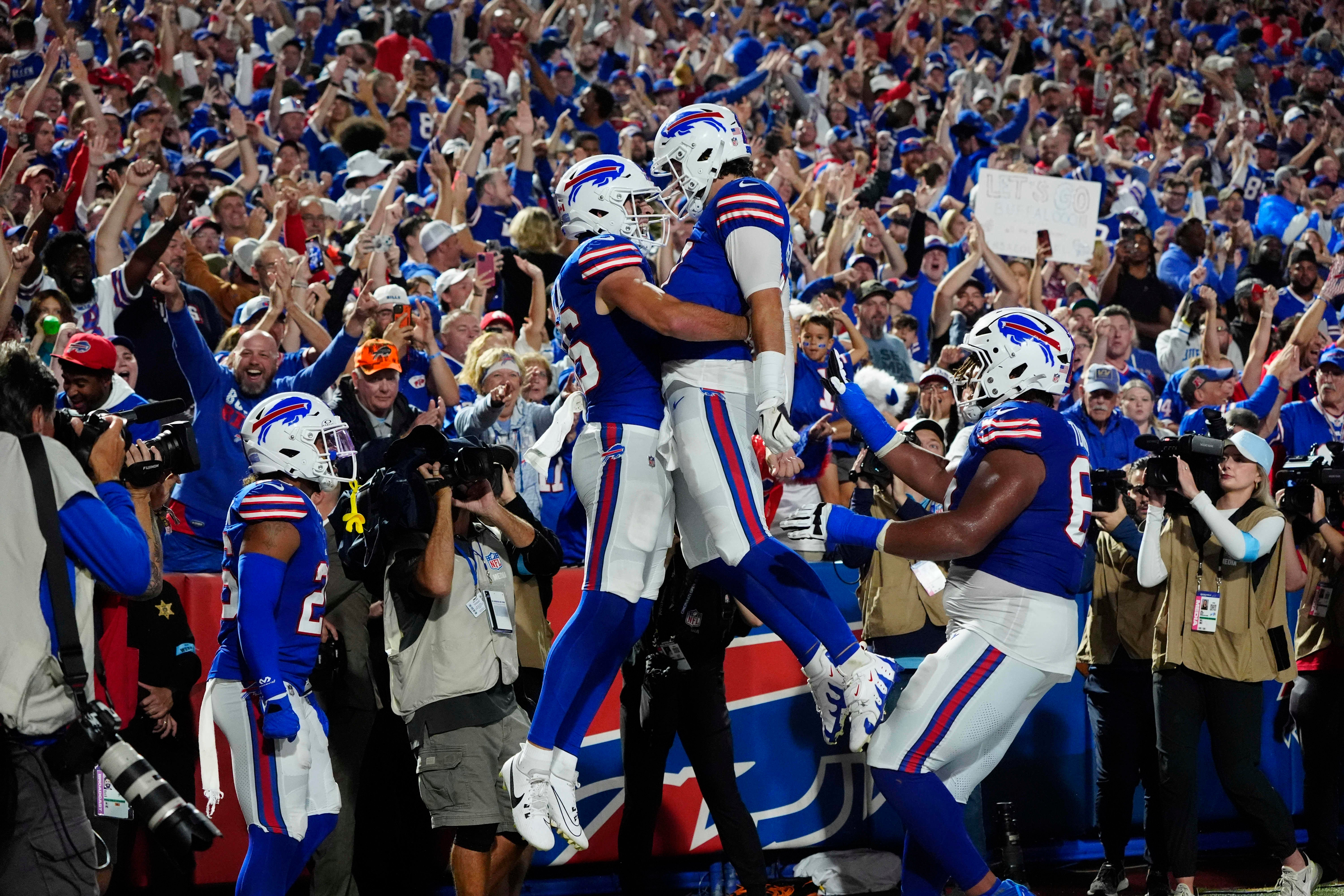 Sep 23, 2024; Orchard Park, New York, USA; Buffalo Bills quarterback Josh Allen (17) celebrates a touchdown with Buffalo Bills tight end Dalton Kincaid (86) during the first half at Highmark Stadium.