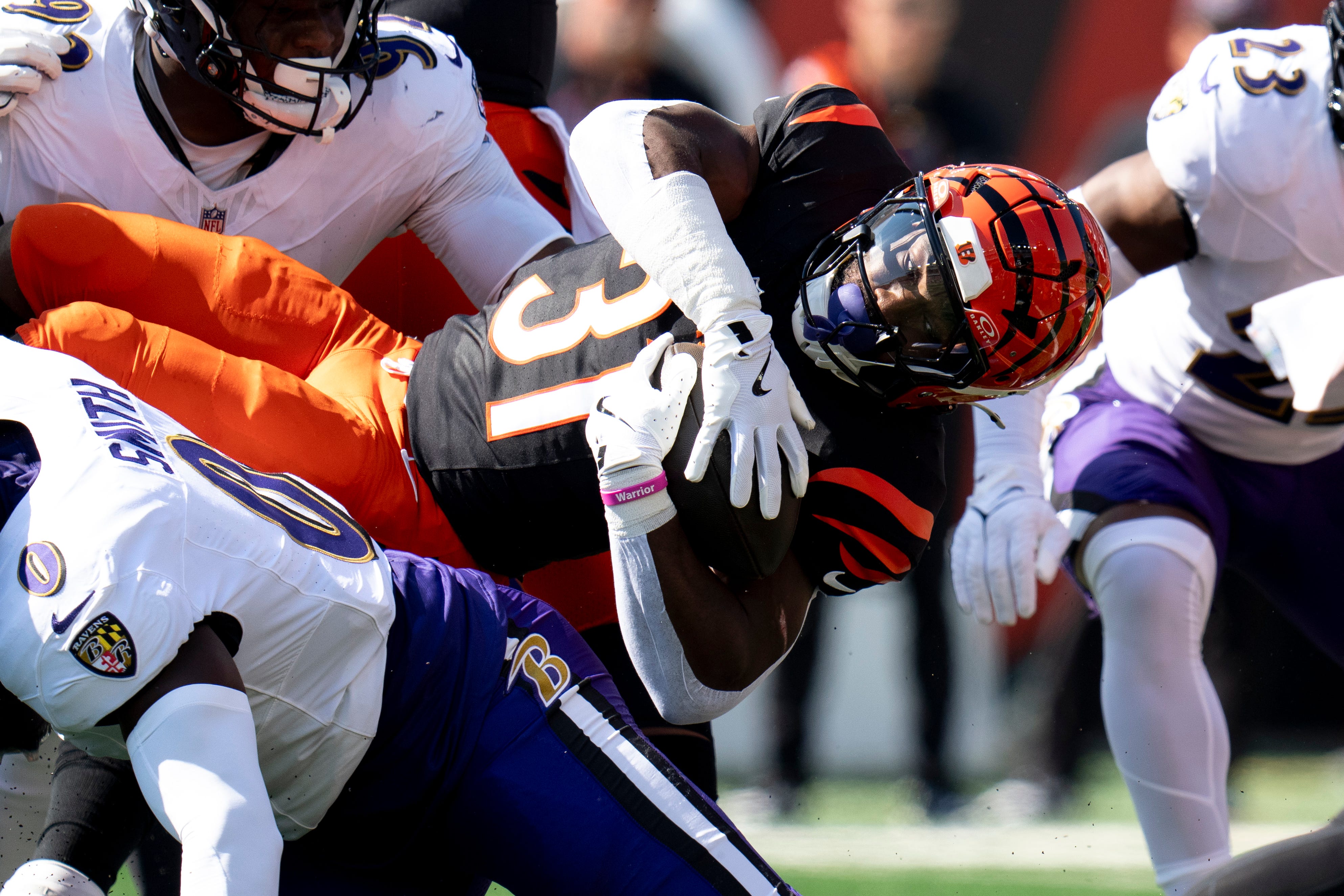 Baltimore Ravens inside linebacker Roquan Smith (0) tackles Cincinnati Bengals halfback Zack Moss (31) in the first quarter of the NFL game at Paycor Stadium in Cincinnati on Sunday, Oct. 6, 2024.