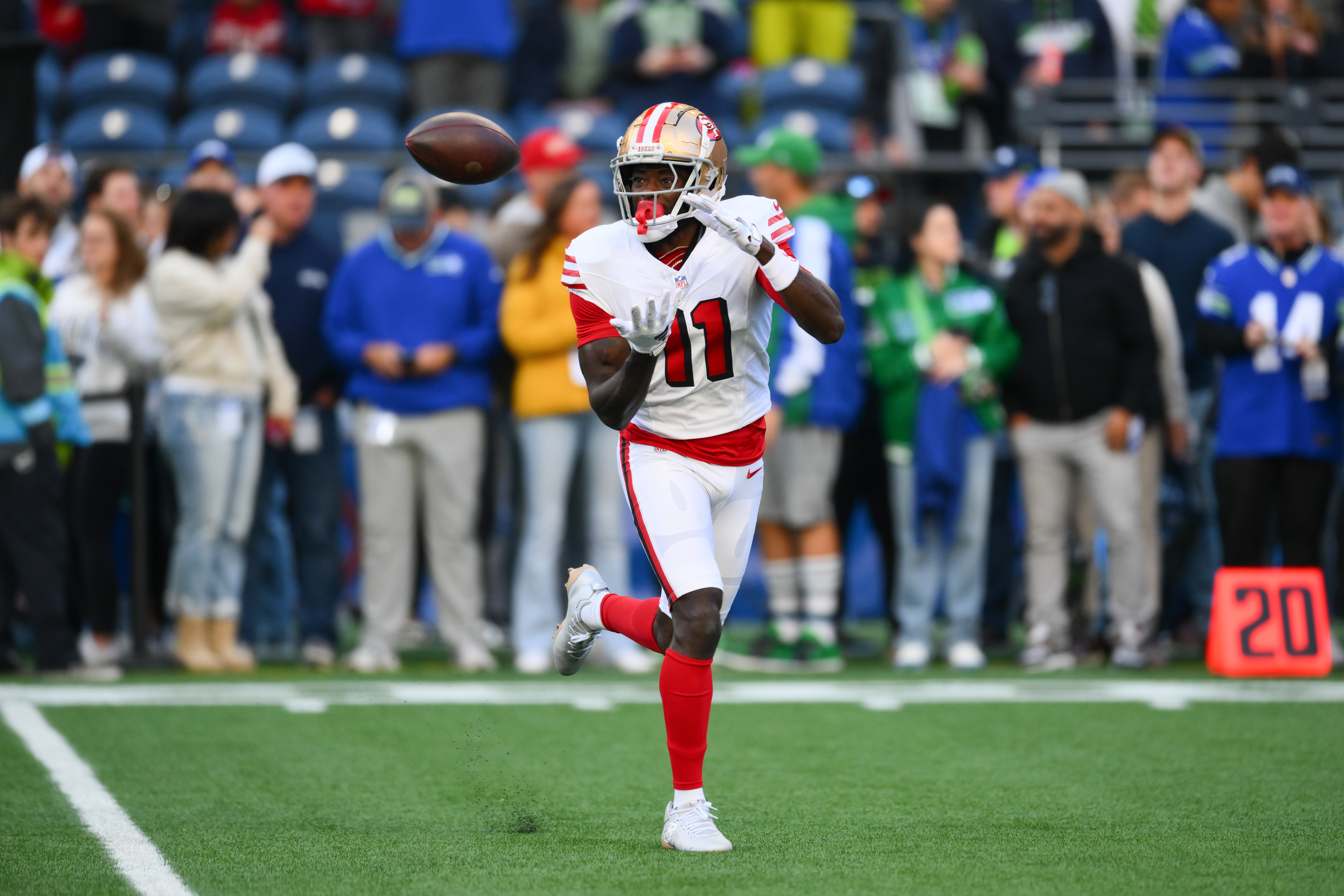 Oct 10, 2024; Seattle, Washington, USA; San Francisco 49ers wide receiver Brandon Aiyuk (11) catches the ball during warmups before the game against the Seattle Seahawks at Lumen Field.