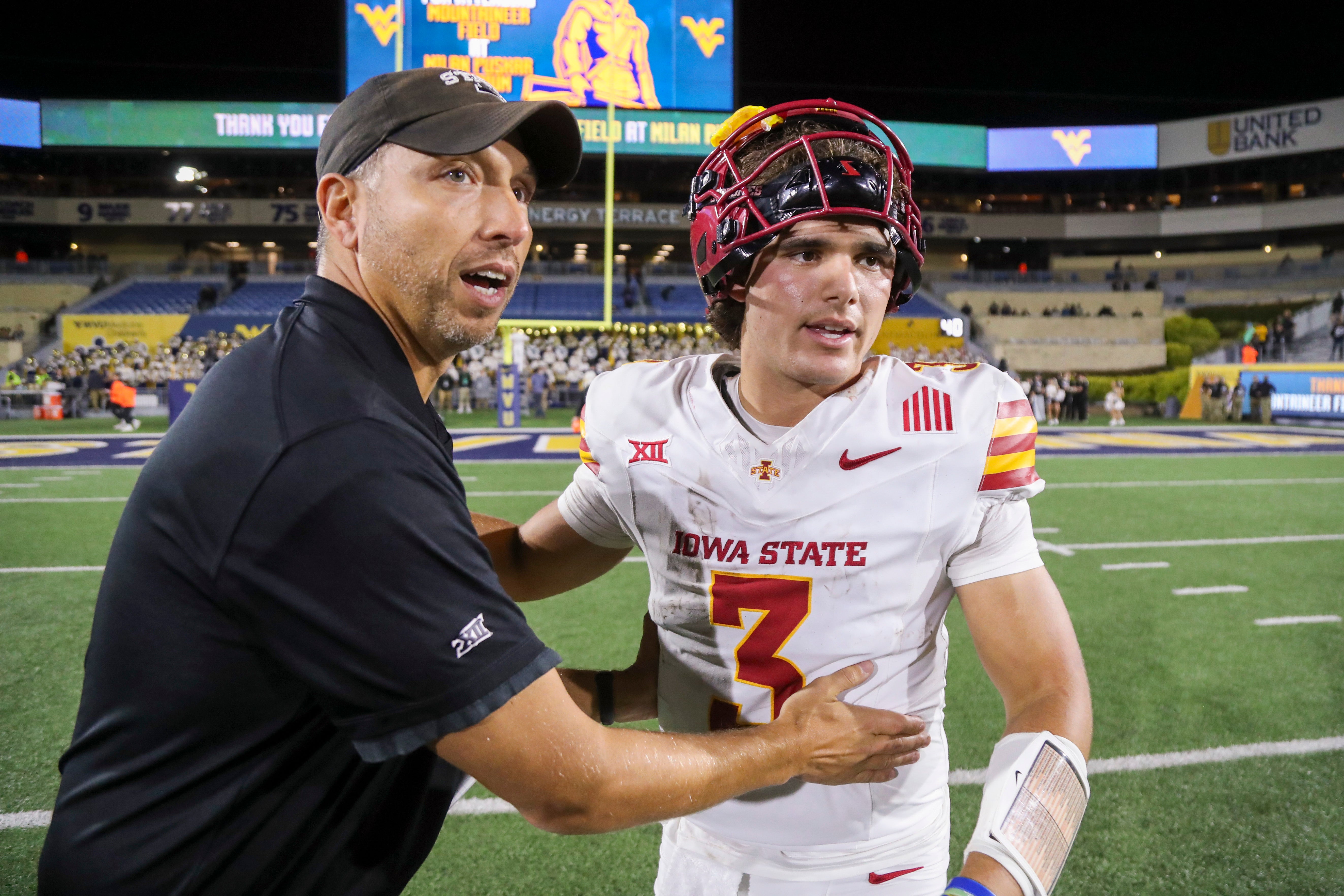 Oct 12, 2024; Morgantown, West Virginia, USA; Iowa State Cyclones head coach Matt Campbell celebrates with quarterback Rocco Becht (3) after defeating the West Virginia Mountaineers at Mountaineer Field at Milan Puskar Stadium. Mandatory Credit: Ben Queen-Imagn Images