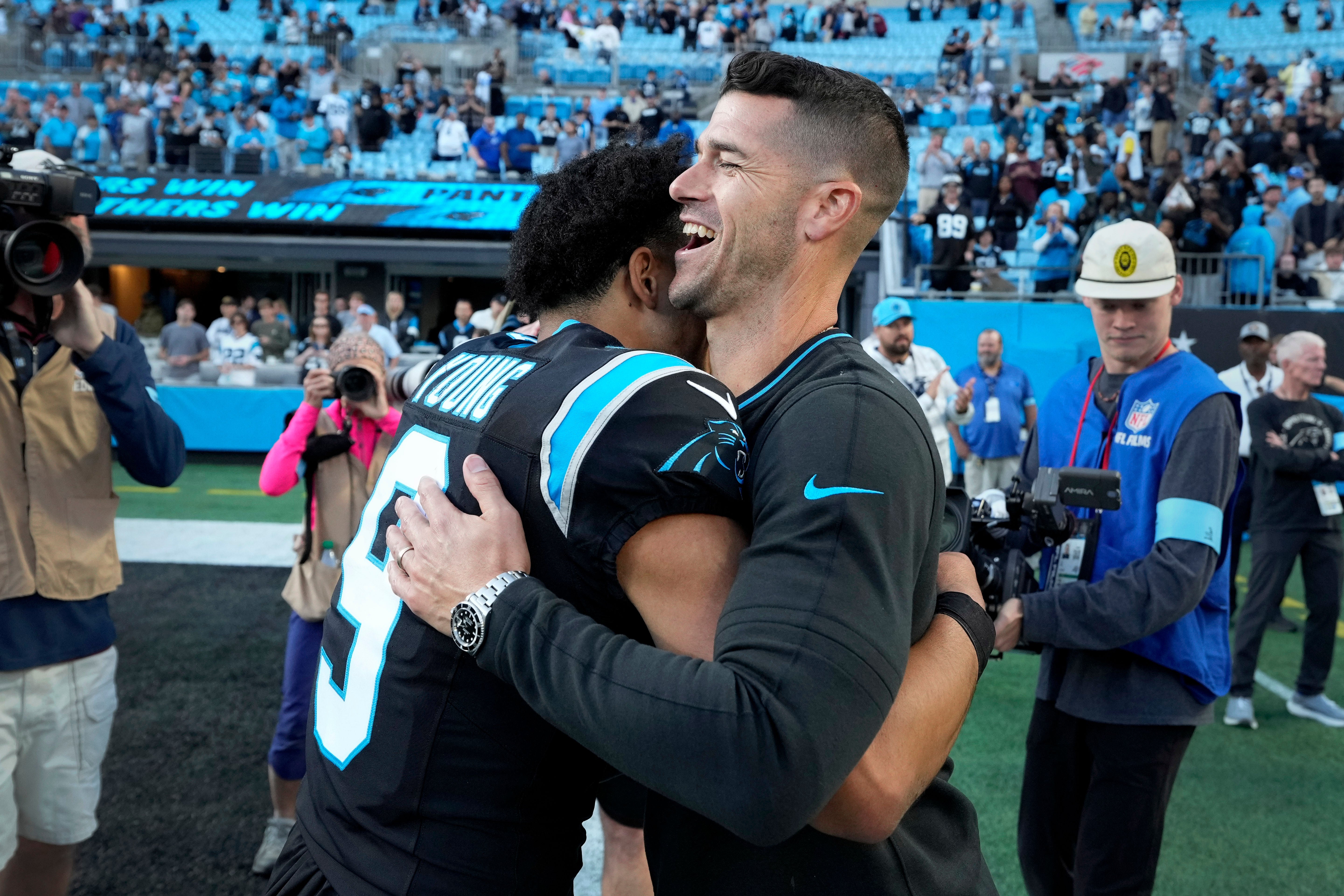 Nov 3, 2024; Charlotte, North Carolina, USA; Carolina Panthers quarterback Bryce Young (9) with head coach Dave Canales after the game at Bank of America Stadium.