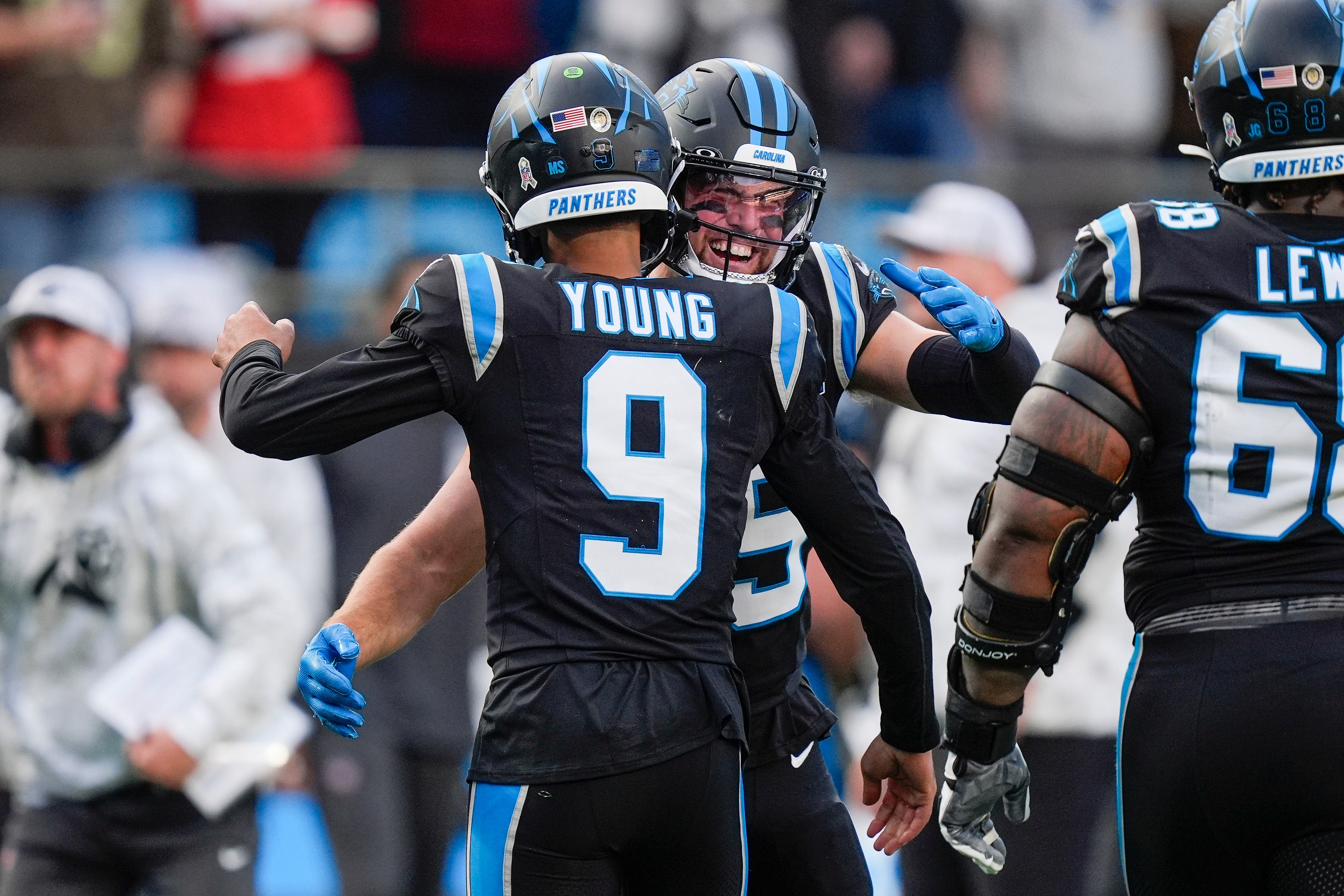 Nov 24, 2024; Charlotte, North Carolina, USA; Carolina Panthers quarterback Bryce Young (9) is congratulated by wide receiver Adam Thielen (19) after his touchdown drive against the Kansas City Chiefs during the second half at Bank of America Stadium.