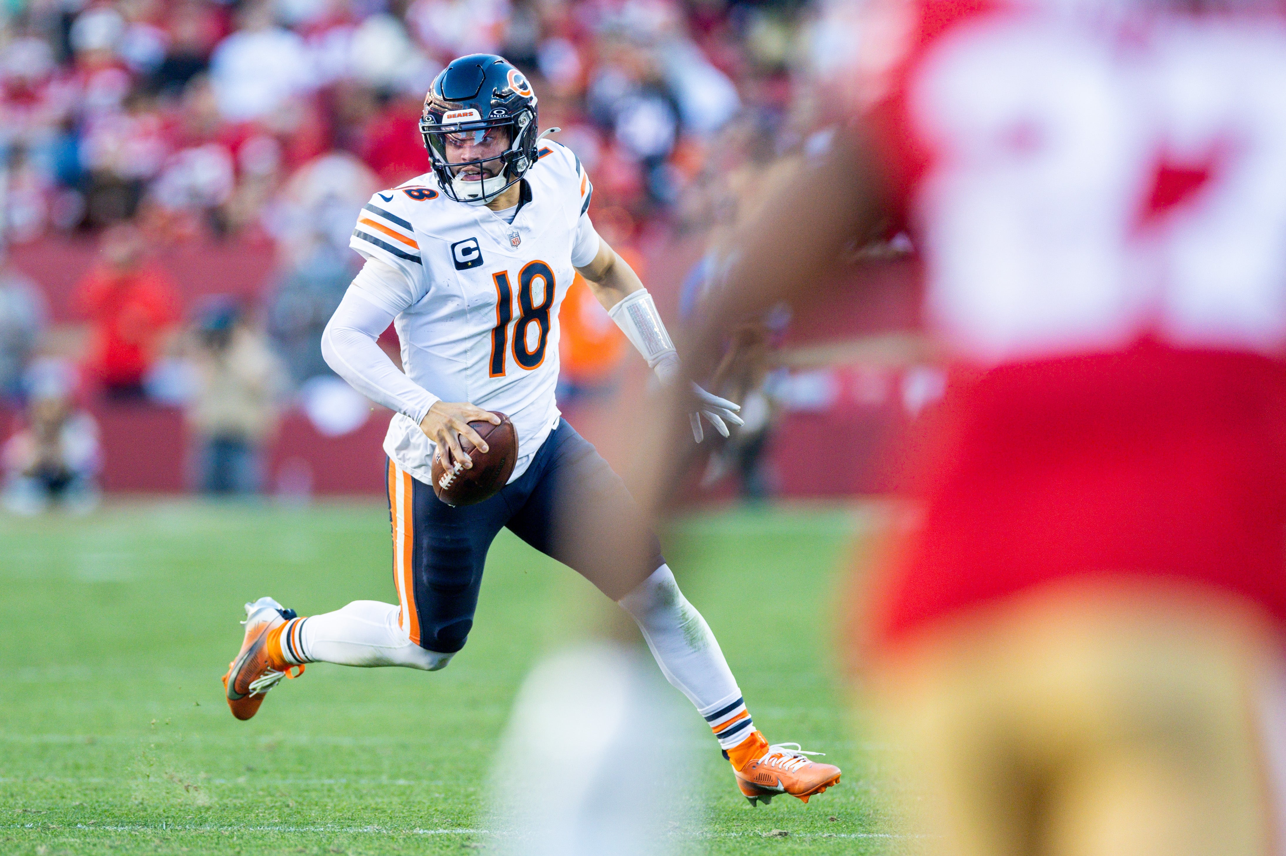 Dec 8, 2024; Santa Clara, California, USA; Chicago Bears quarterback Caleb Williams (18) scrambles during the fourth quarter against the San Francisco 49ers at Levi's Stadium.
