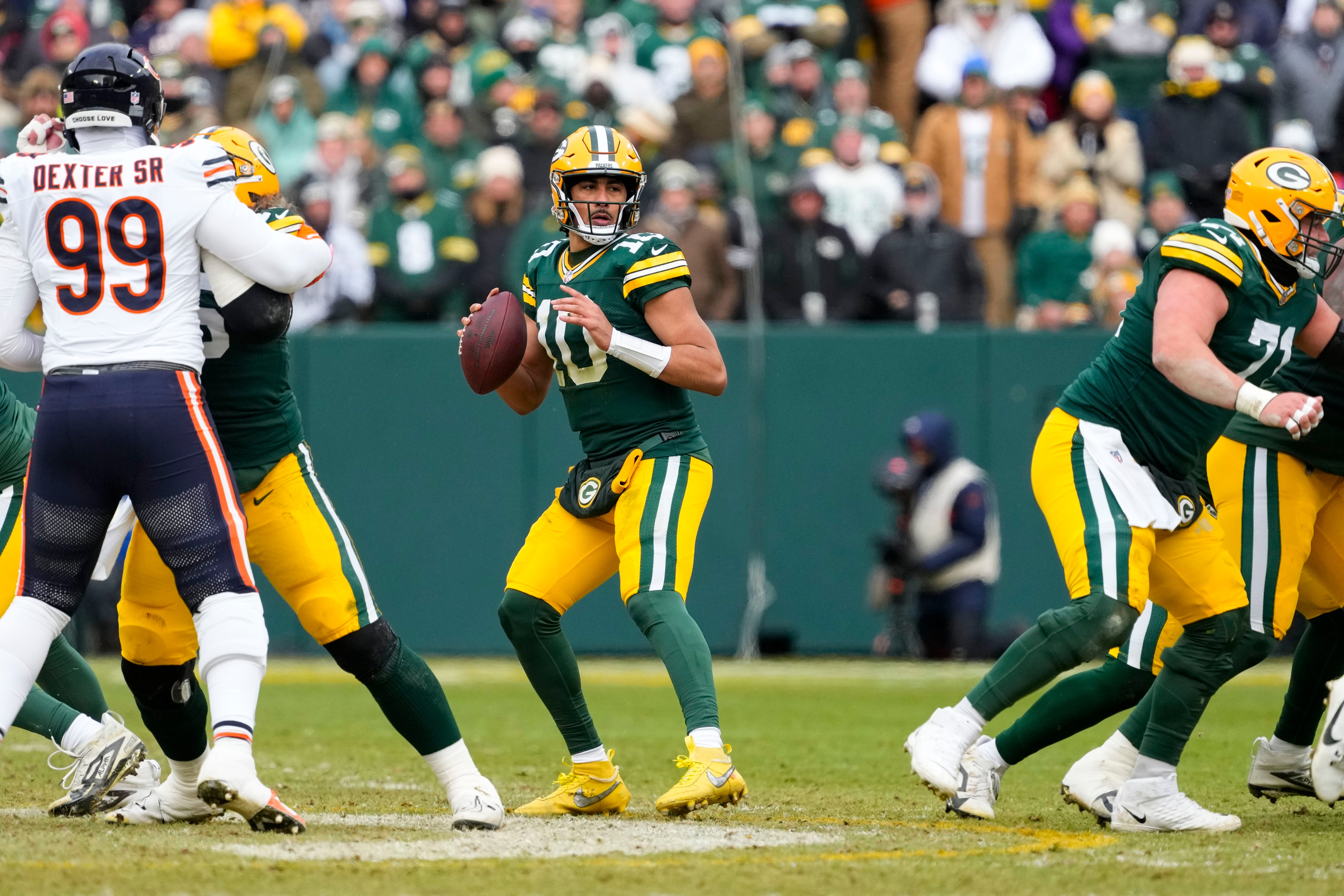 Jan 5, 2025; Green Bay, Wisconsin, USA; Green Bay Packers quarterback Jordan Love (10) drops back to pass during the first quarter against the Chicago Bears at Lambeau Field.