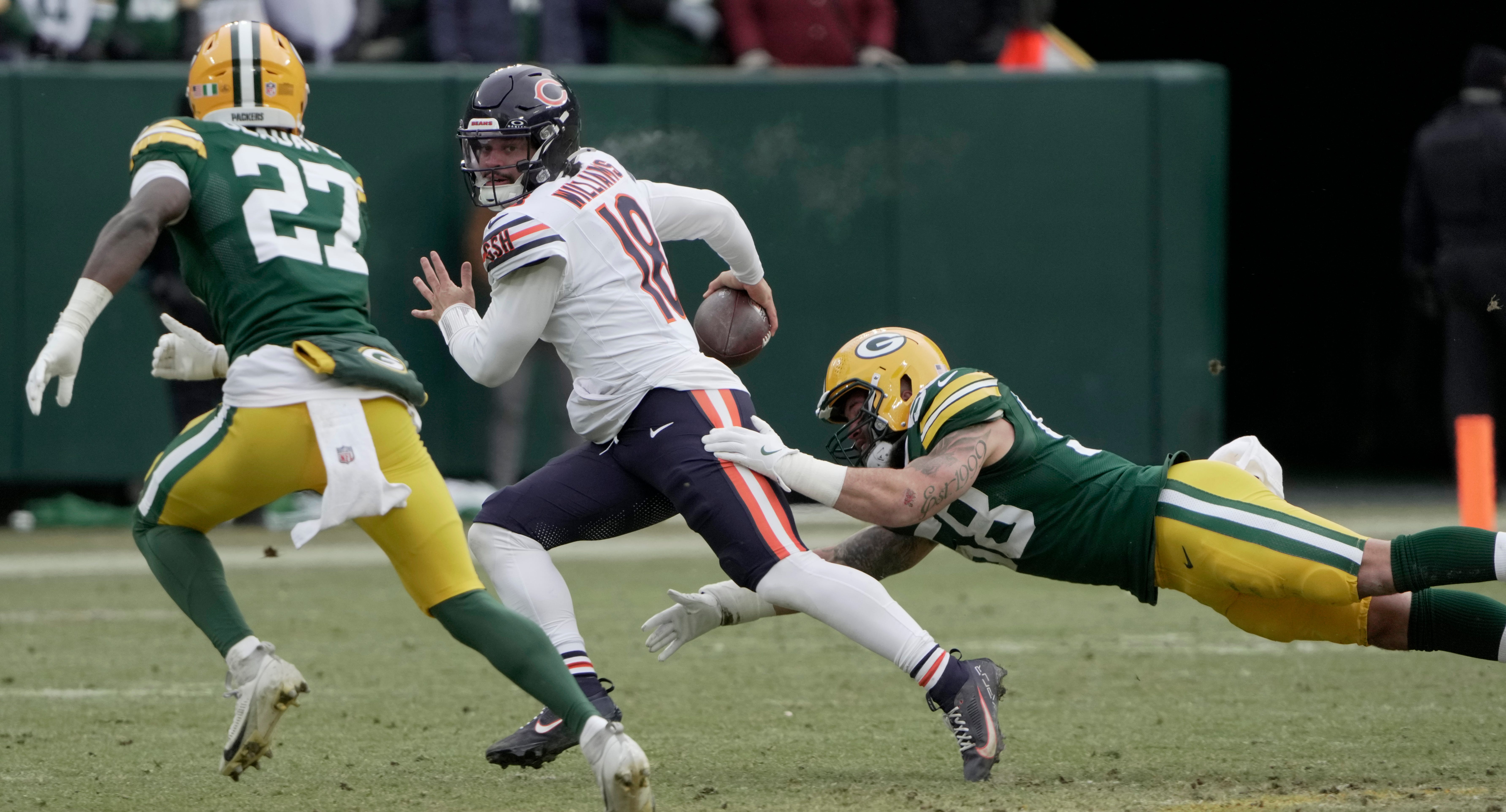 Chicago Bears quarterback Caleb Williams (18) avoids a sack during the fourth quarter of their game Sunday, January 5, 2025 at Lambeau Field in Green Bay, Wisconsin.