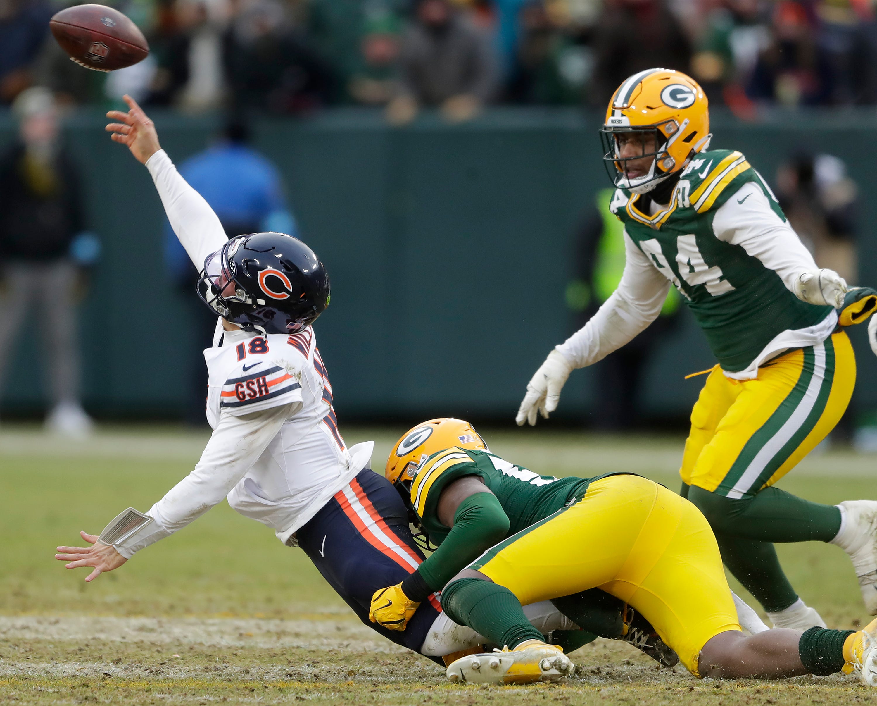 Green Bay Packers linebacker Edgerrin Cooper (56) wraps up Chicago Bears quarterback Caleb Williams (18) on Sunday, January 5, 2024 at Lambeau Field in Green Bay, Wis. The Bears defeated the Packers 24-22.