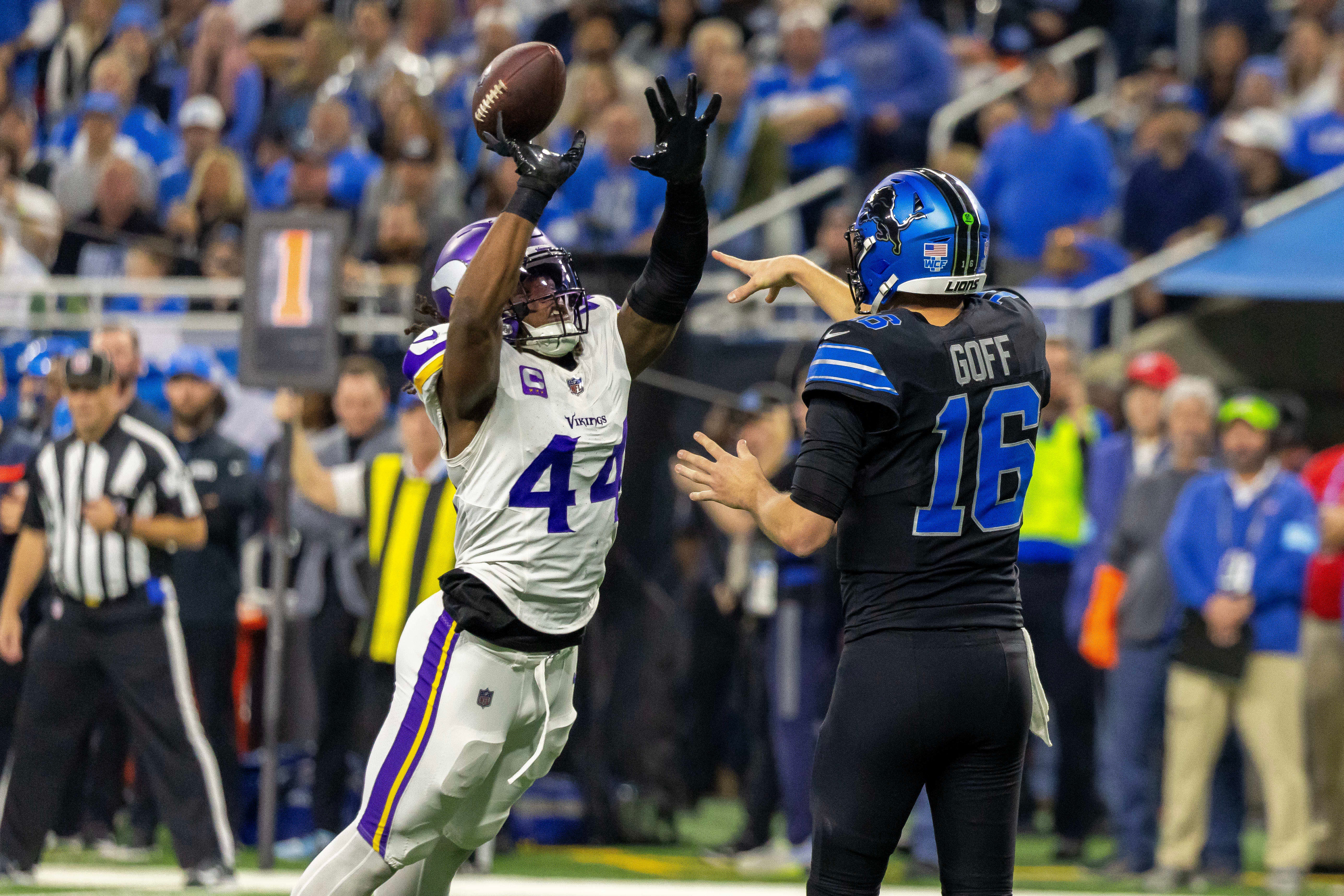 Jan 5, 2025; Detroit, Michigan, USA; Minnesota Vikings safety Josh Metellus (44) tips a pass by Detroit Lions quarterback Jared Goff (16) which was intercepted by Minnesota Vikings linebacker Ivan Pace Jr. (0) during the first half at Ford Field.
