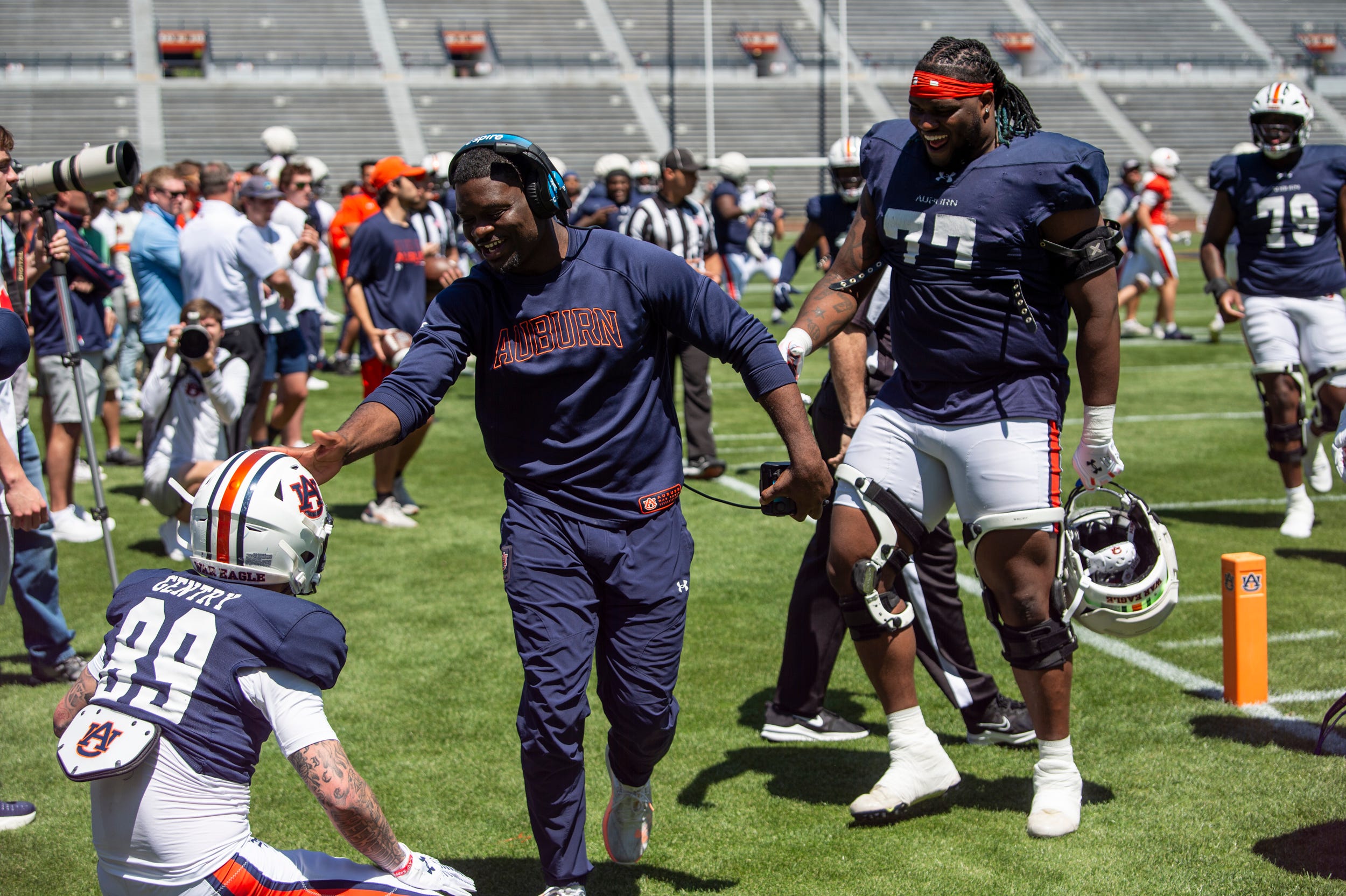Auburn Tigers wide receiver coach Marcus Davis celebrates with Auburn Tigers wide receiver Dylan Gentry (89) during Auburn Tigers A-Day football practice at Jordan-Hare Stadium in Auburn, Ala., on Saturday, April 12, 2025.