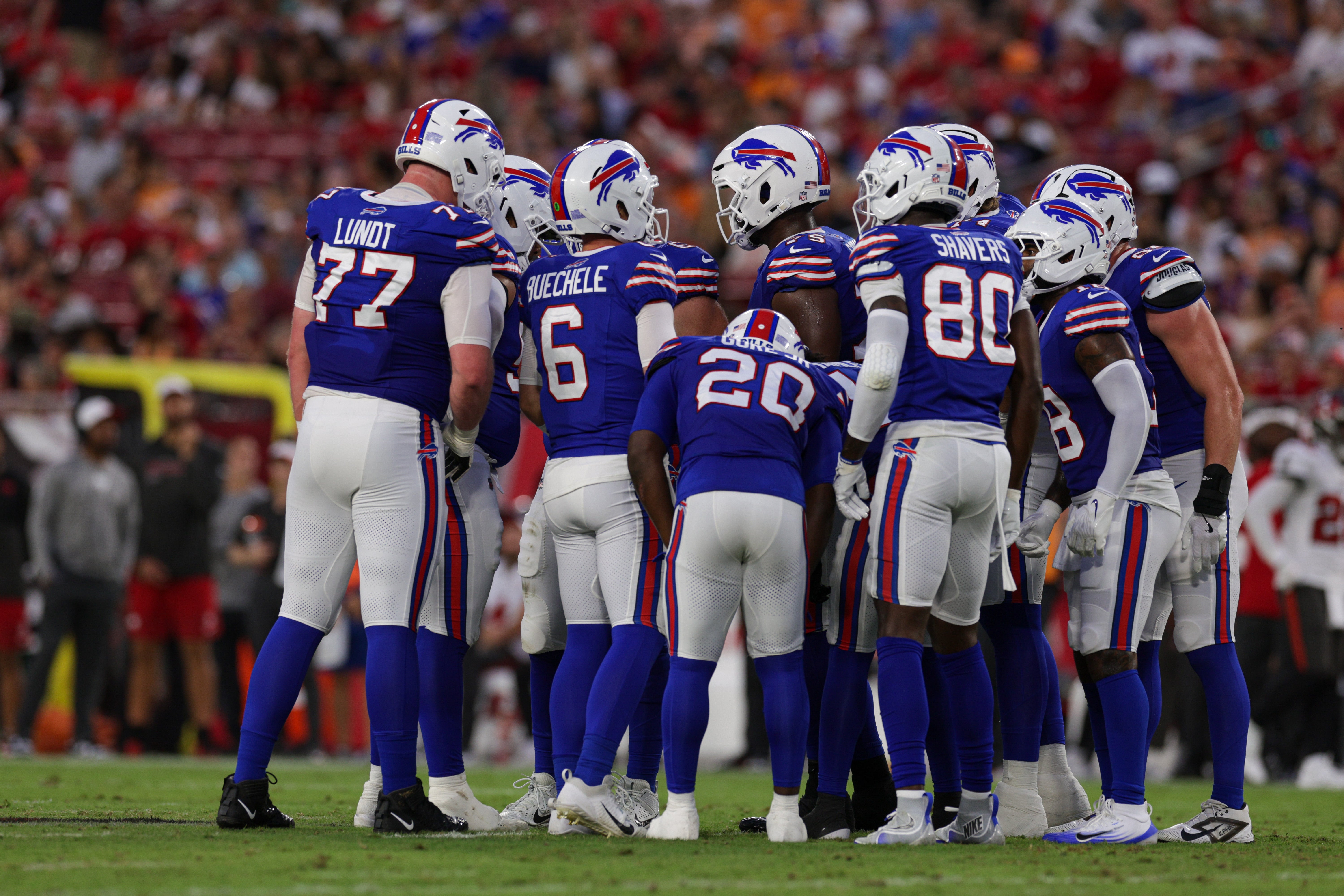 Aug 23, 2025; Tampa, Florida, USA; Buffalo Bills quarterback Shane Buechele (6) leads a huddle against the Tampa Bay Buccaneers in the first quarter at Raymond James Stadium.
