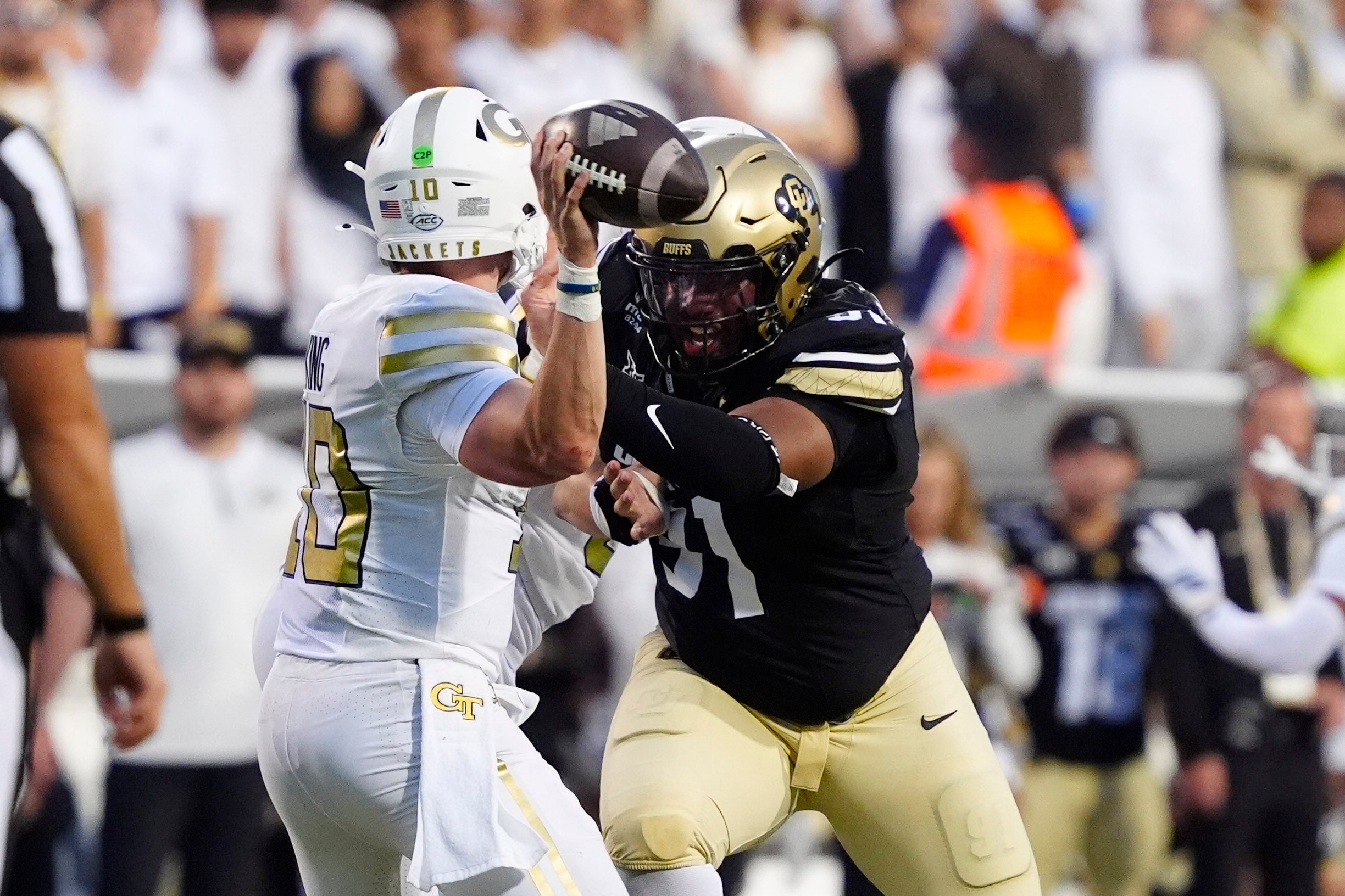 Aug 29, 2025; Boulder, Colorado, USA; Colorado Buffaloes defensive end Brandon Davis-Swain (91) hurries Georgia Tech Yellow Jackets quarterback Haynes King (10) in the second quarter at Folsom Field. Mandatory Credit: Ron Chenoy-Imagn Images