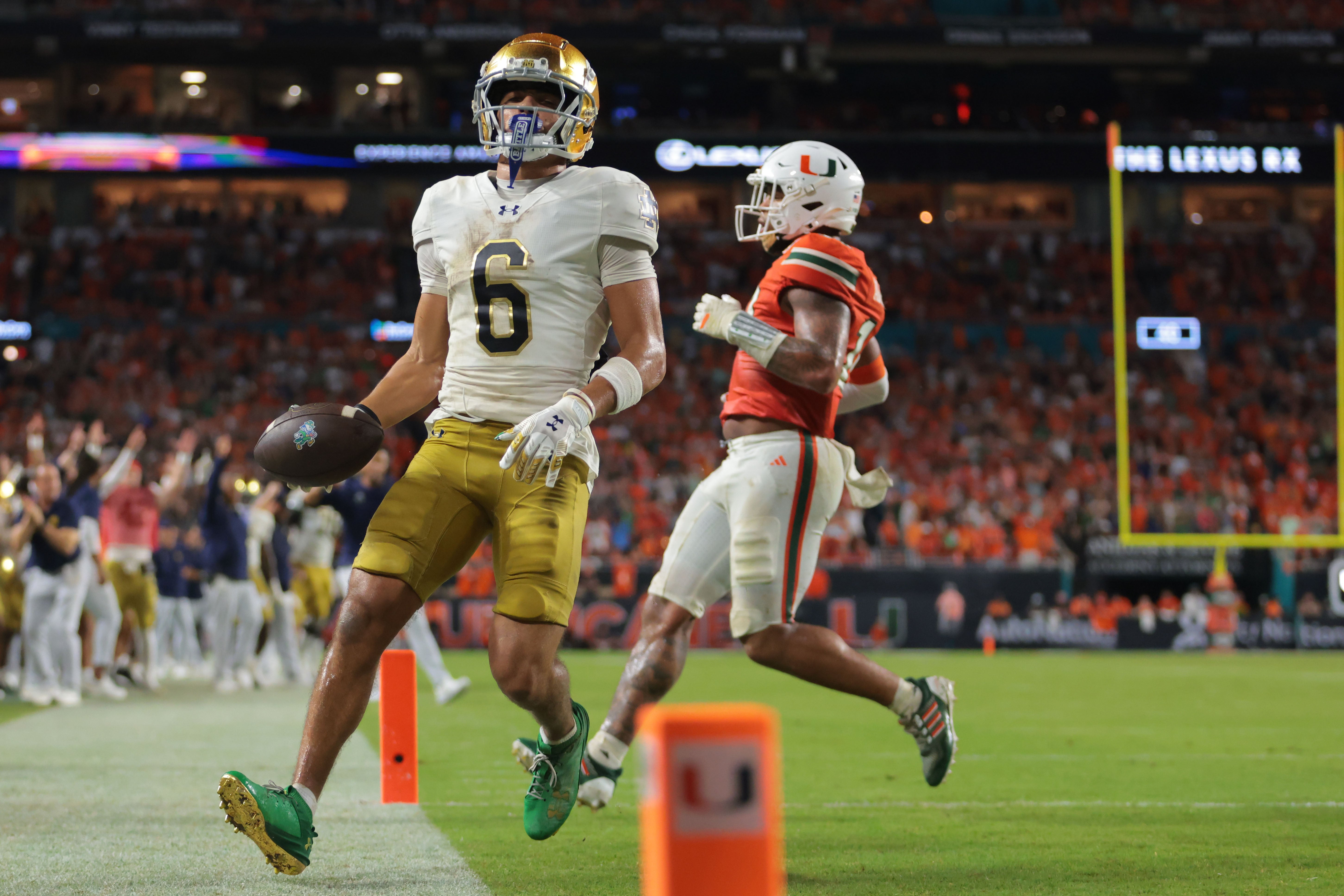 Aug 31, 2025; Miami Gardens, Florida, USA; Notre Dame Fighting Irish wide receiver Jordan Faison (6) scores a touchdown against the Miami Hurricanes during the third quarter at Hard Rock Stadium. Mandatory Credit: Sam Navarro-Imagn Images