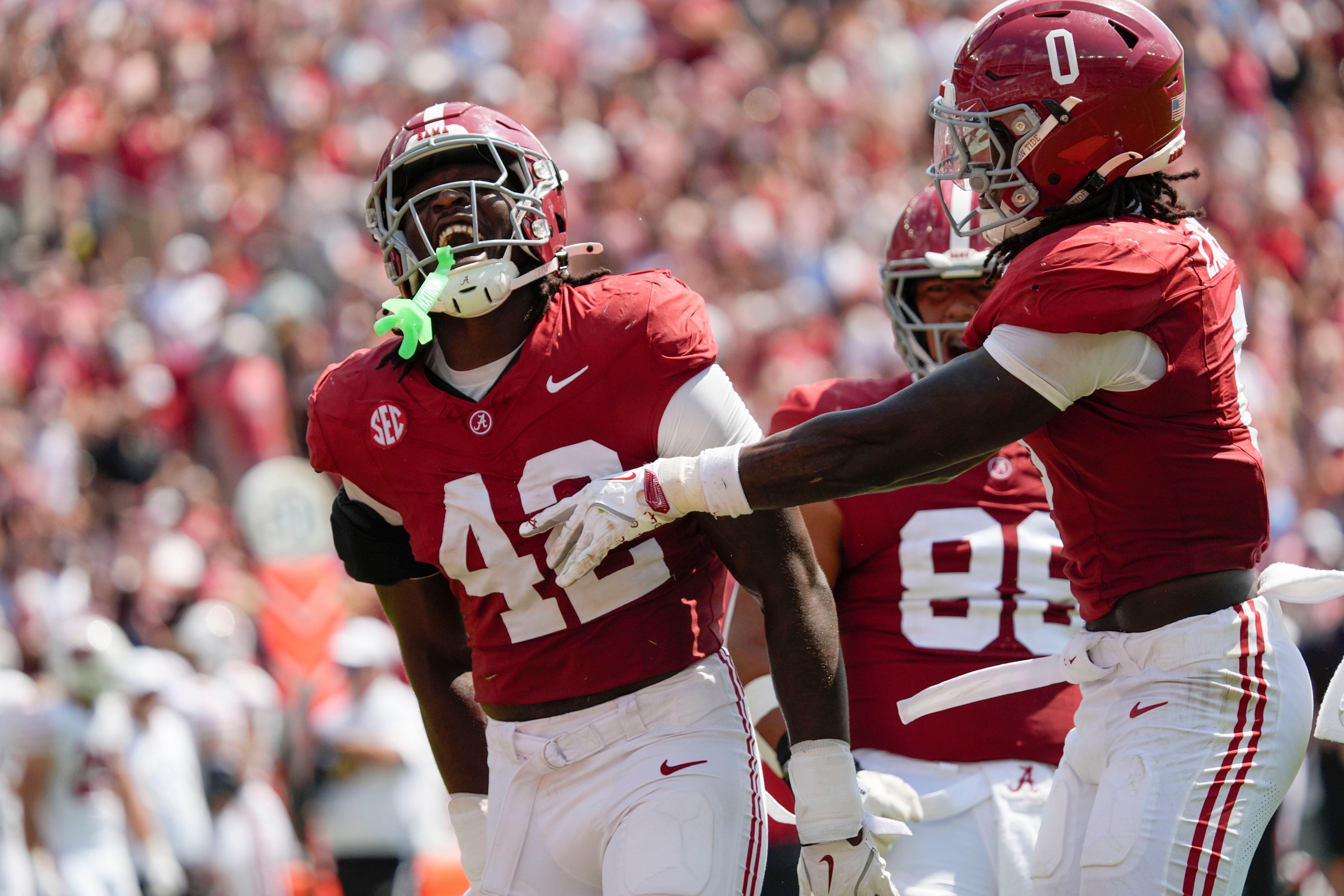 Sep 13, 2025; Tuscaloosa, Alabama, USA; Alabama linebacker Yhonzae Pierre (42) celebrates a sack with Alabama linebacker Deontae Lawson (0) during the game with Wisconsin at Saban Field at Bryant-Denny Stadium.