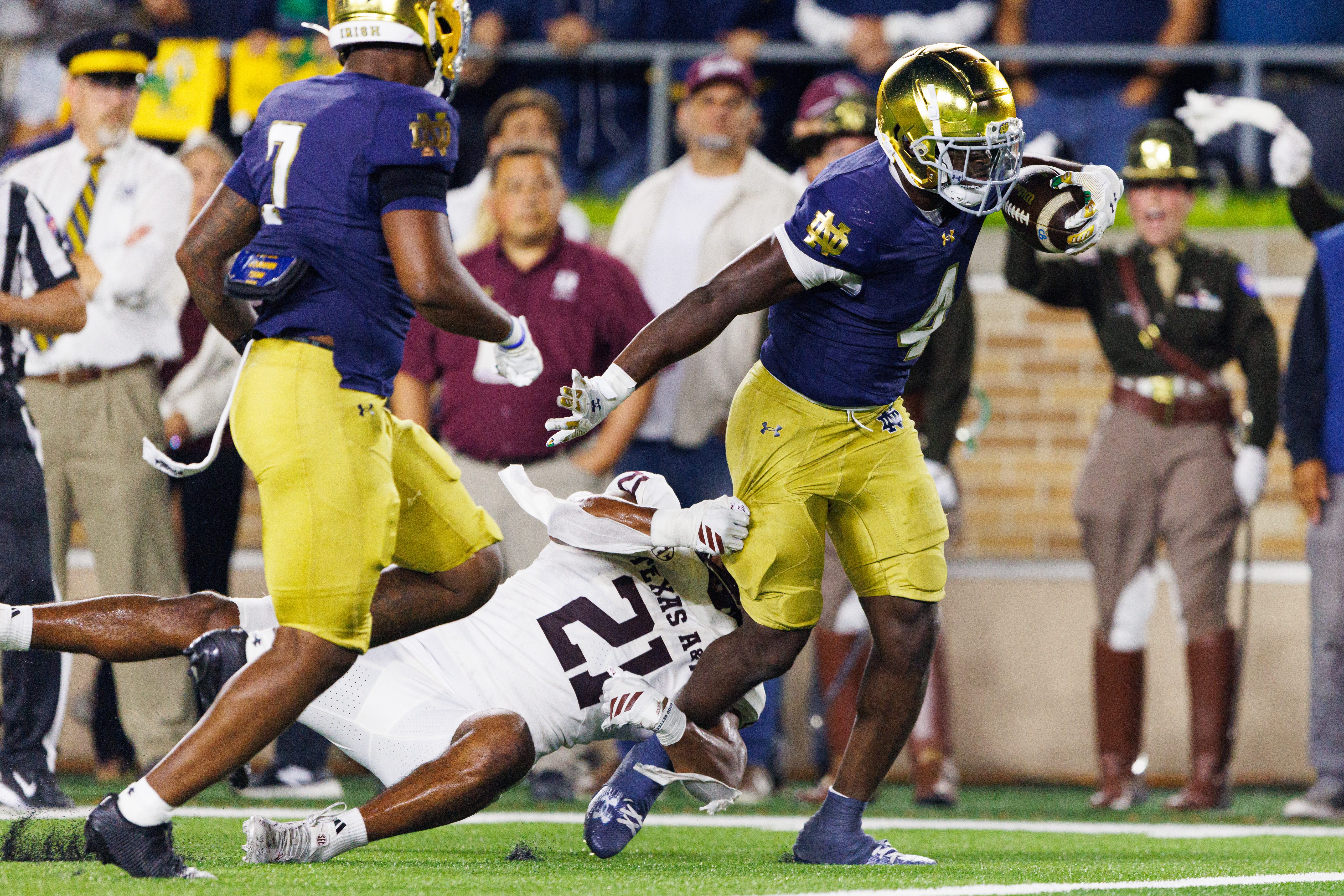 Notre Dame running back Jeremiyah Love (4) runs through a tackle attempt by Texas A&M linebacker Taurean York (21) to score a touchdown in the second half of a NCAA football game at Notre Dame Stadium on Saturday, Sept. 13, 2025, in South Bend.