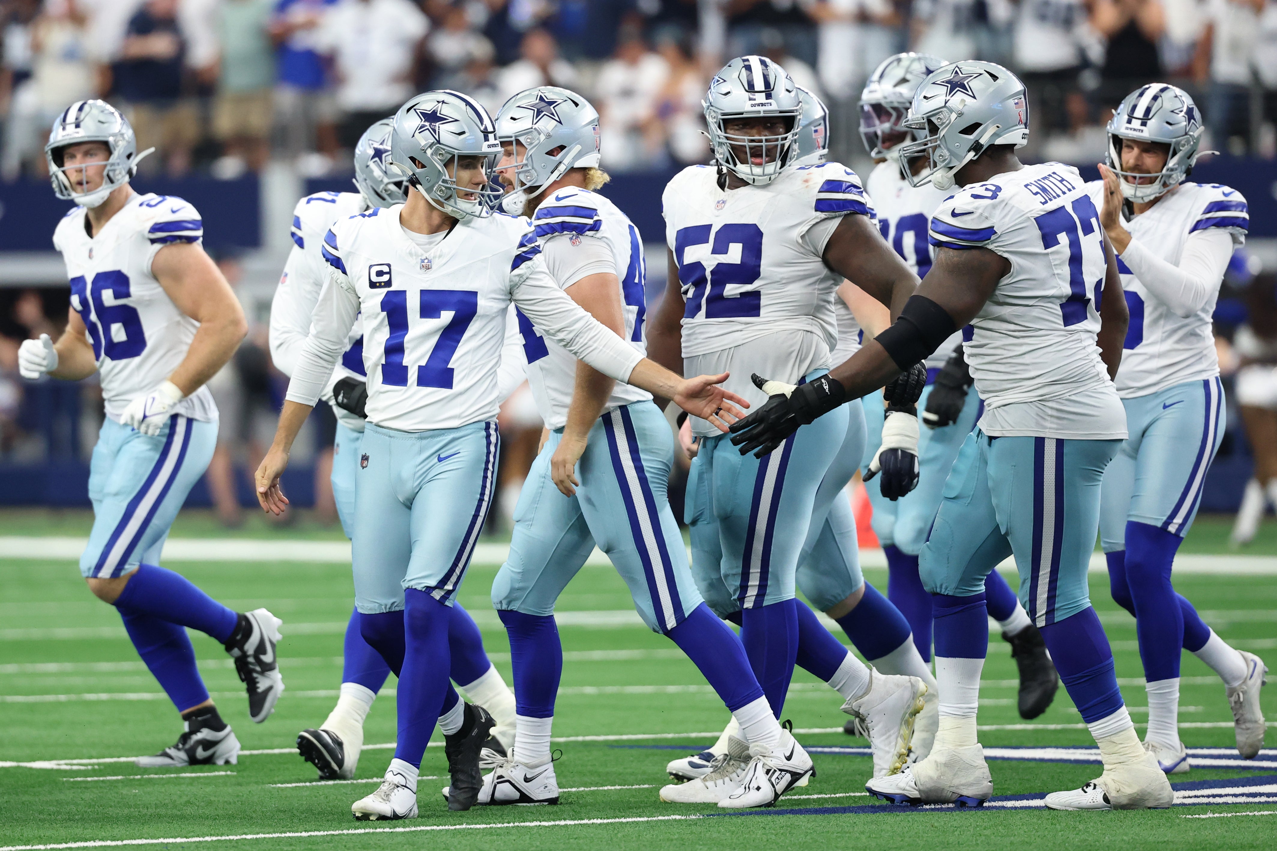 Sep 14, 2025; Arlington, Texas, USA; Dallas Cowboys place kicker Brandon Aubrey (17) high fives guard Tyler Smith (73) after making a field goal against the New York Giants to tie the game during the fourth quarter at AT&T Stadium.