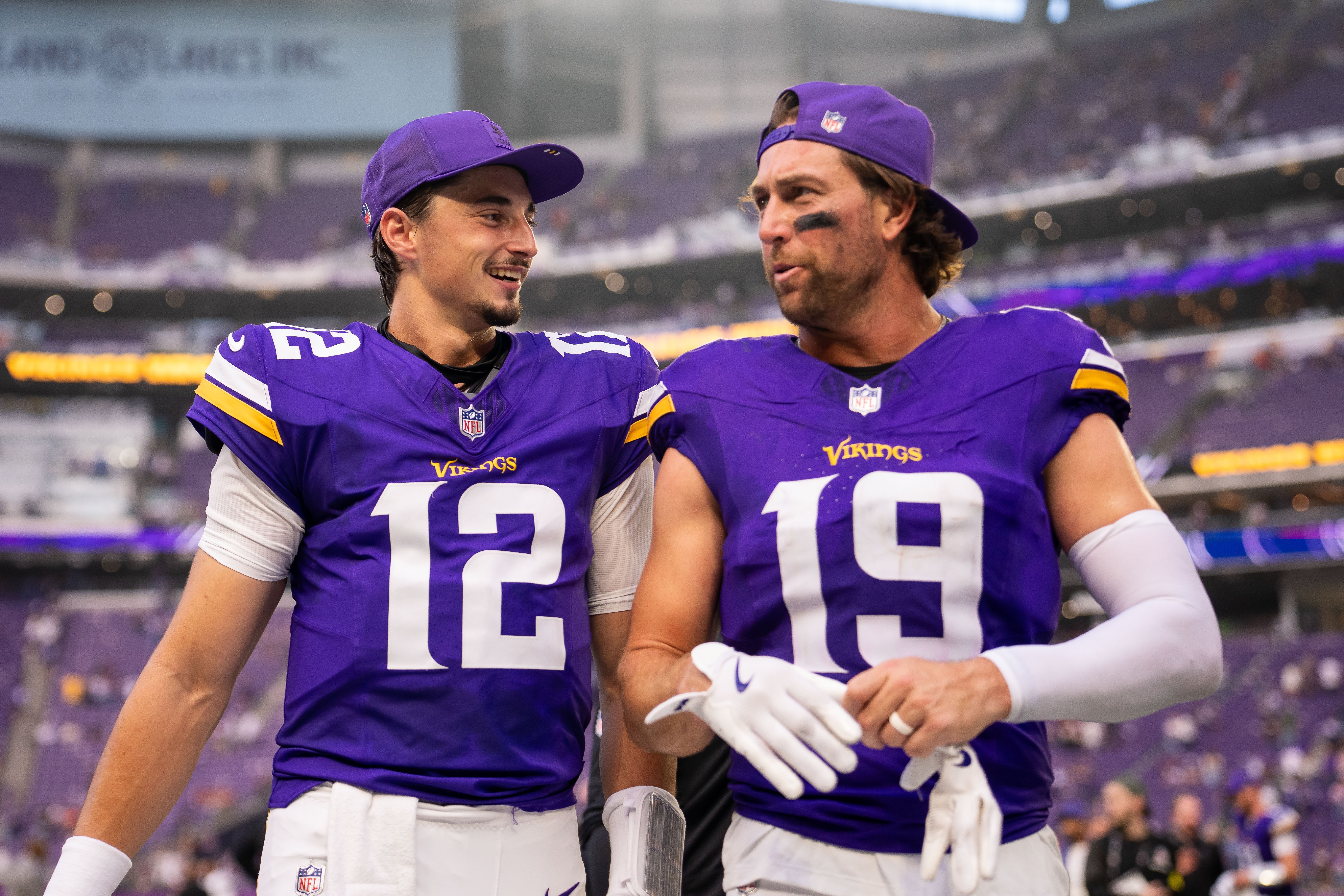 Sep 21, 2025; Minneapolis, Minnesota, USA; Minnesota Vikings quarterback Max Brosmer (12) and wide receiver Adam Thielen (19) following the game against the Cincinnati Bengals at U.S. Bank Stadium.