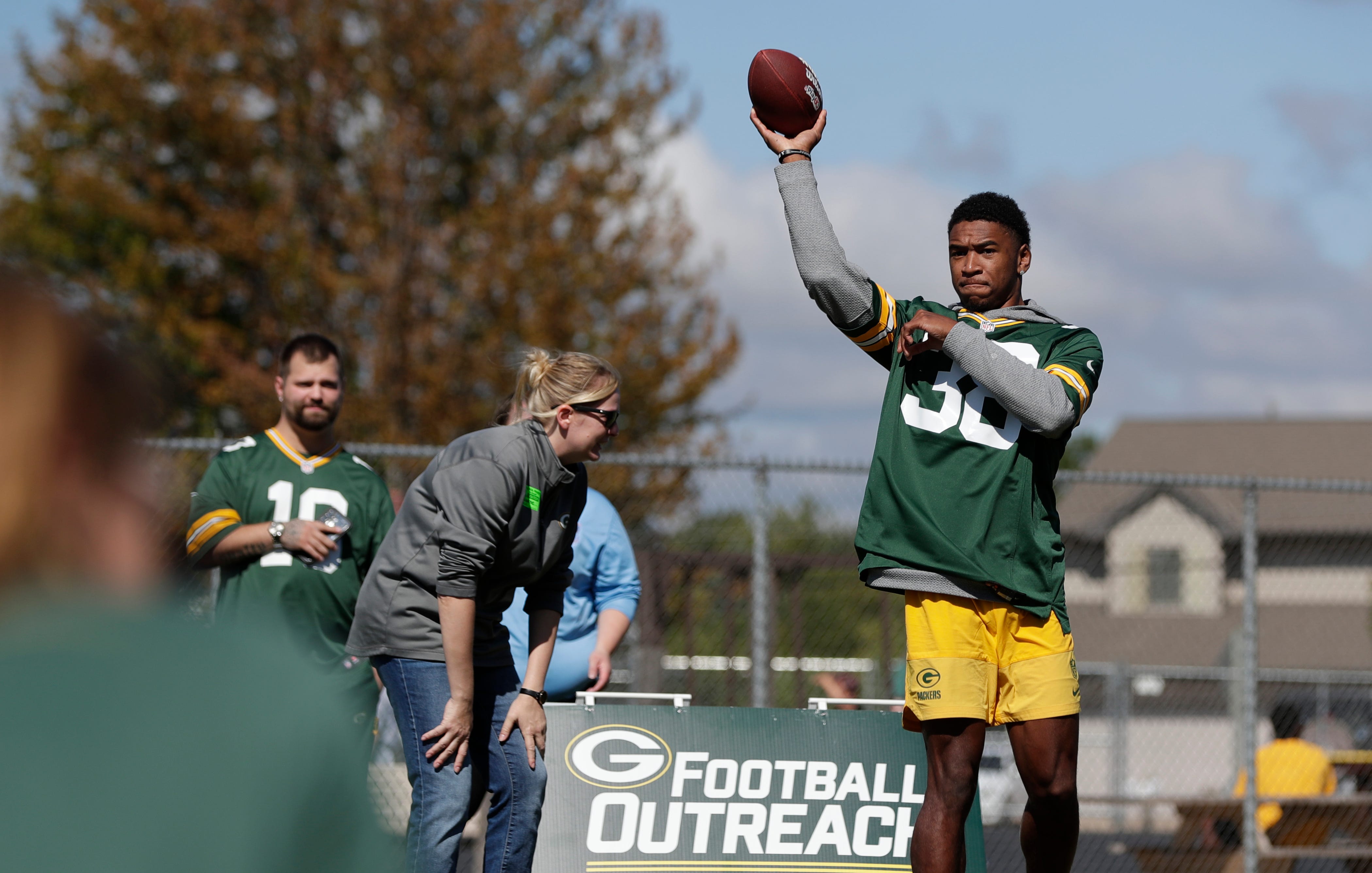 Green Bay Packers defensive back Jaylin Simpson passes the ball during a Green Bay Packers Football Outreach Camp at Syble Hopp School on Sept. 23, 2025, in De Pere, Wis. The event, in conjunction with the NFL Play 60 program, provides kids the opportunity to try various football drills.